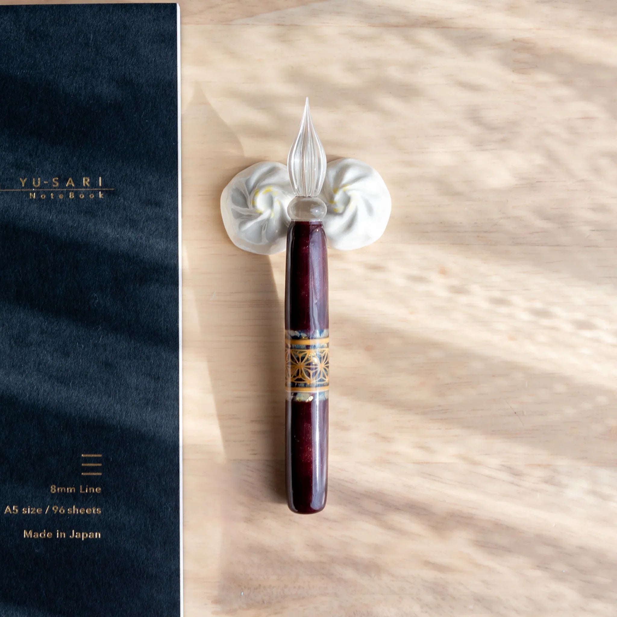 Xiaolongbao dumpling ceramic pen rest handcrafted Japanese with authentic pleated design and fine detail close shot