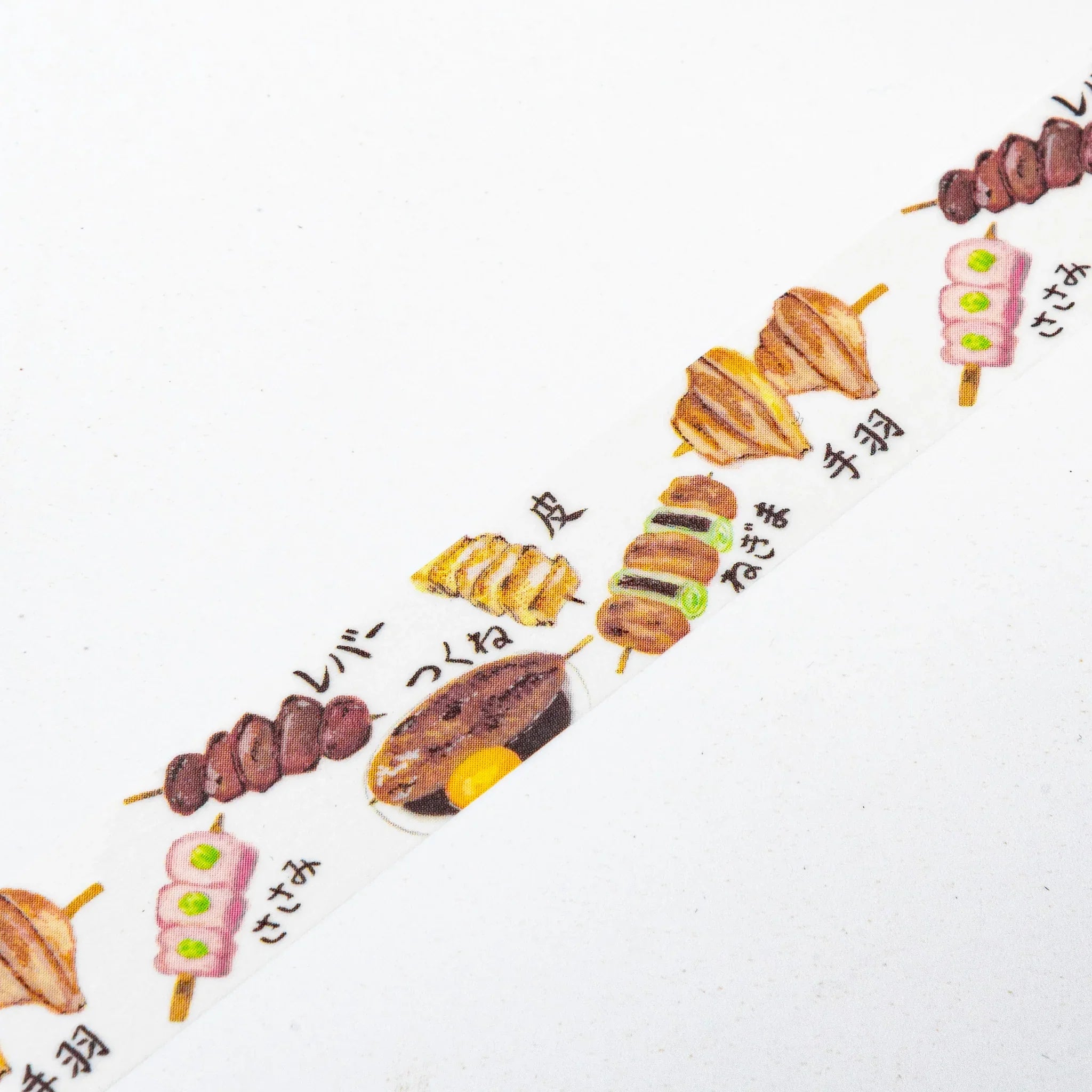 Yakitori Iyo washi tape arranged diagonally showing grilled chicken skewer varieties with vegetables and onions on white