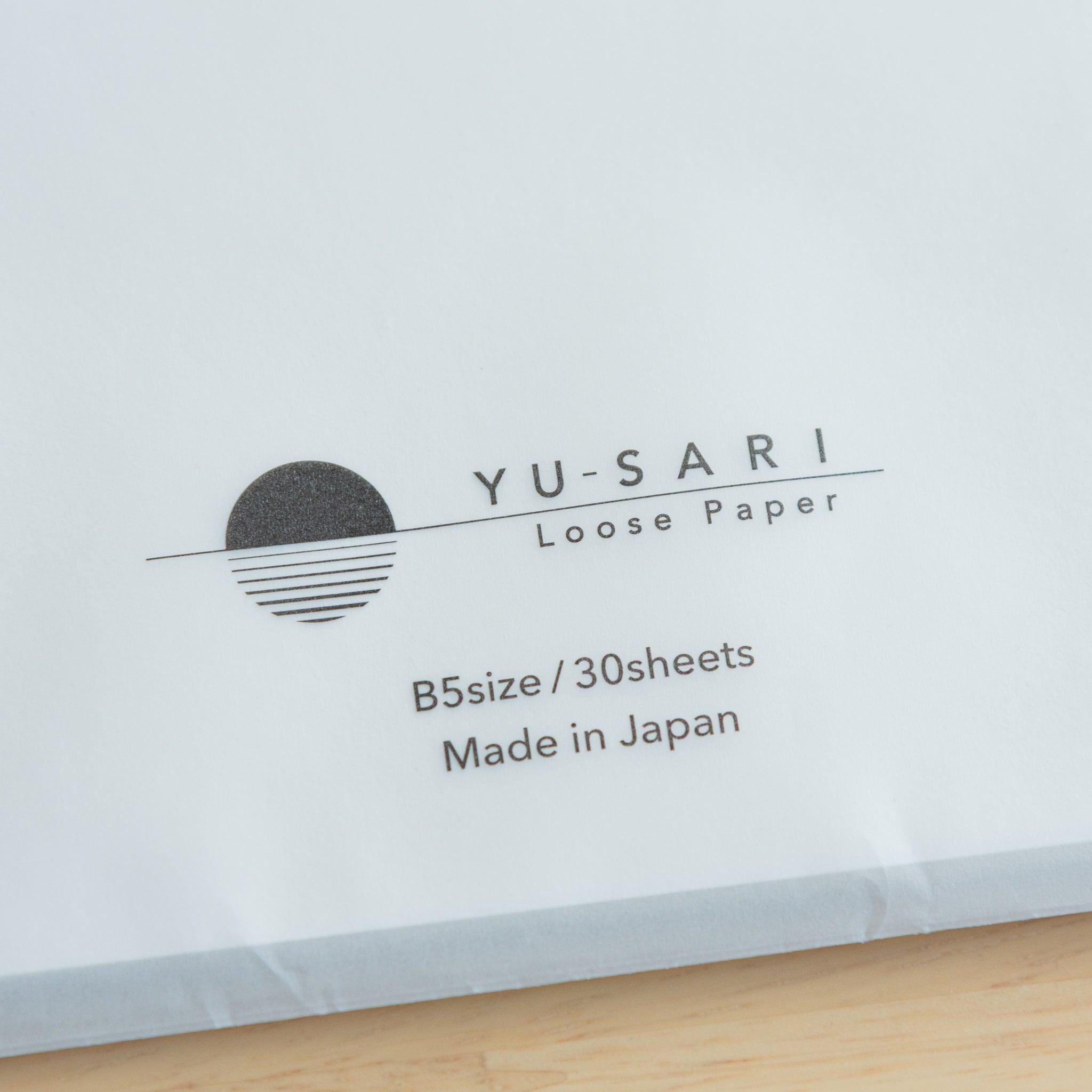 Close-up of YU-SARI Fountain Pen Loose Leaf Paper logo. B5 size, 30 sheets. High-quality Japanese stationery.