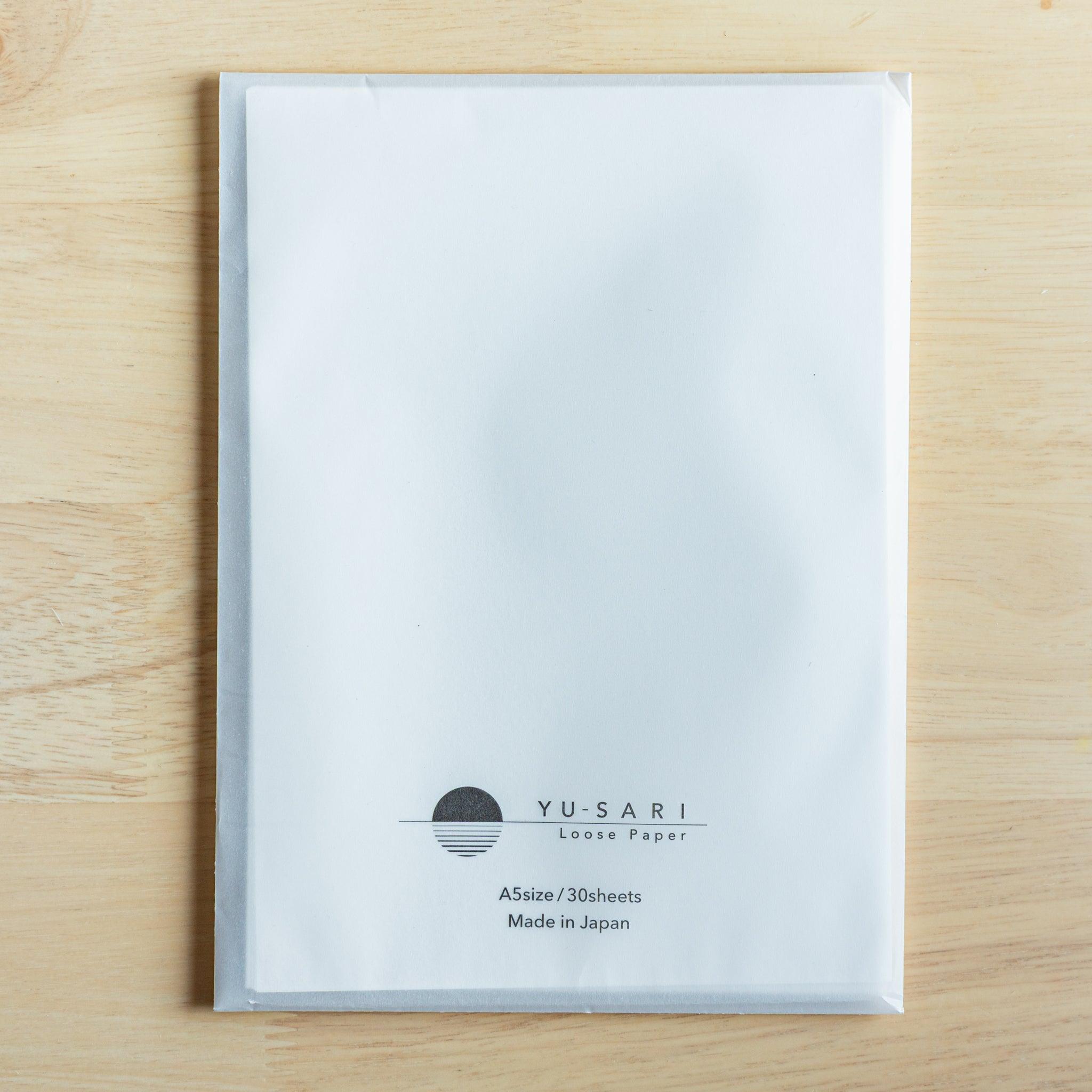 Front view of loose leaf paper. Details of page count and paper size printed. Premium Japanese stationery.