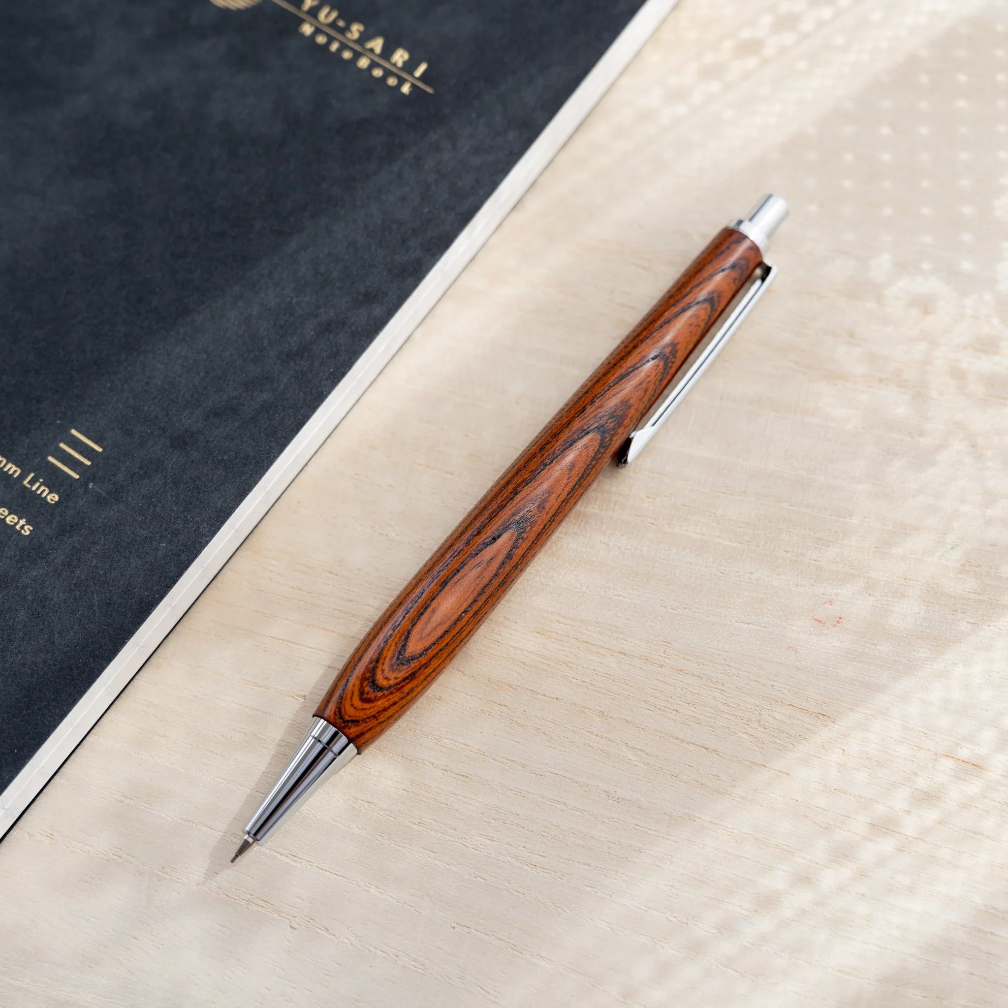 Zelkova wood urushi lacquered mechanical pencil in amber-brown, Japanese keyaki wood, silver knock and extended lead