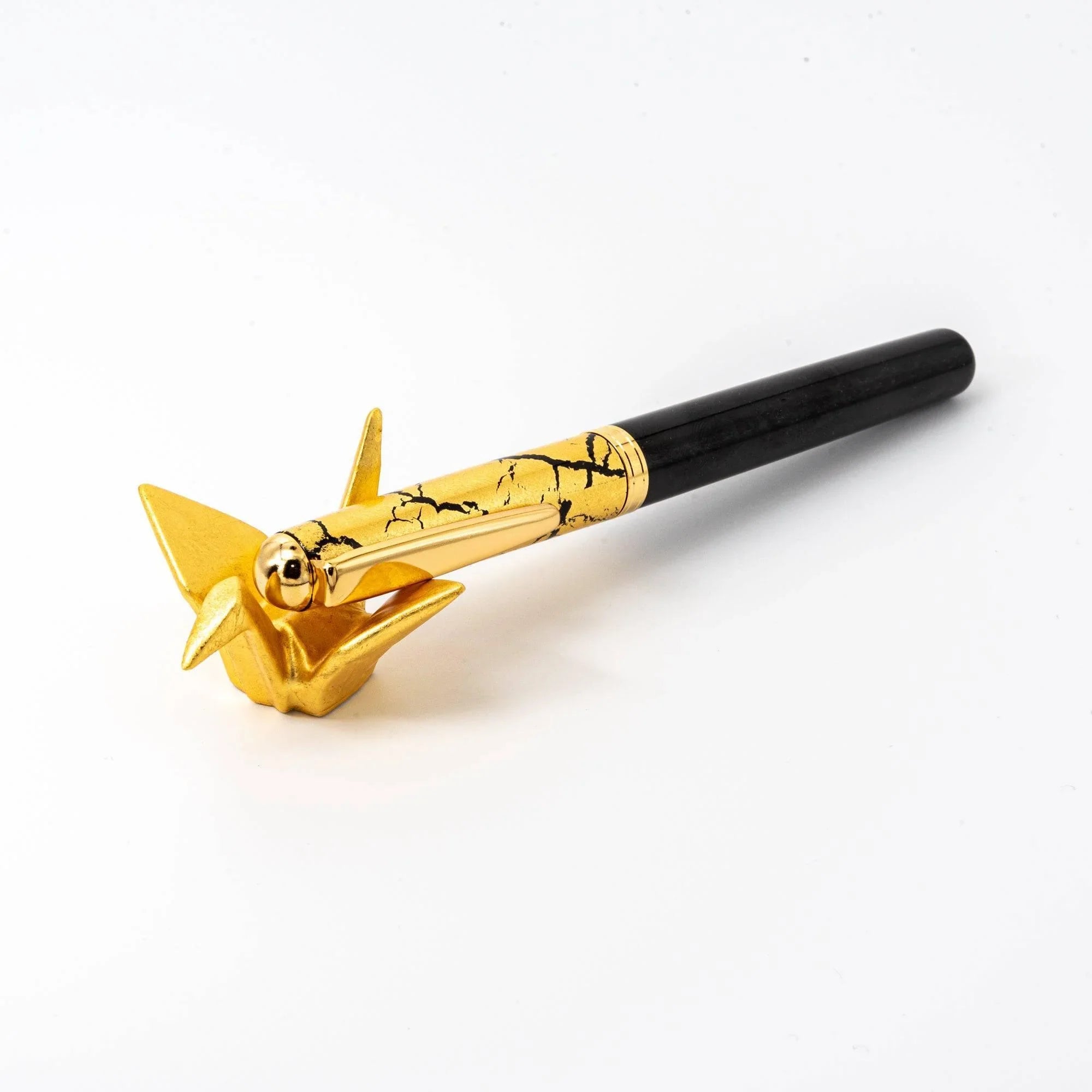 Japanese gold ceramic crane pen rest side profile showing upright neck and pen rest groove carved detail