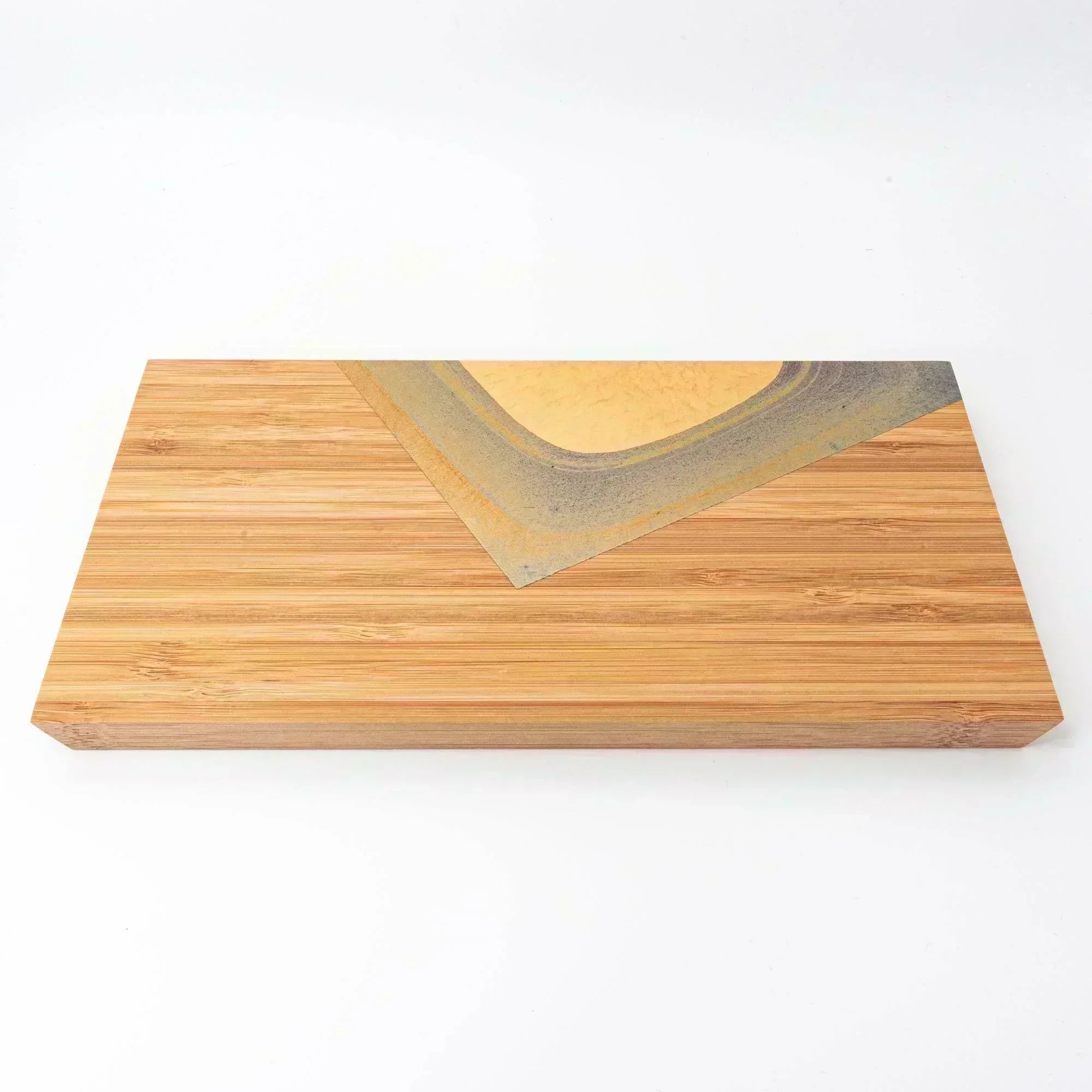 A rectangular bamboo tray with a golden decorative accent, suitable for holding Japanese stationery or as an elegant desk accessory.