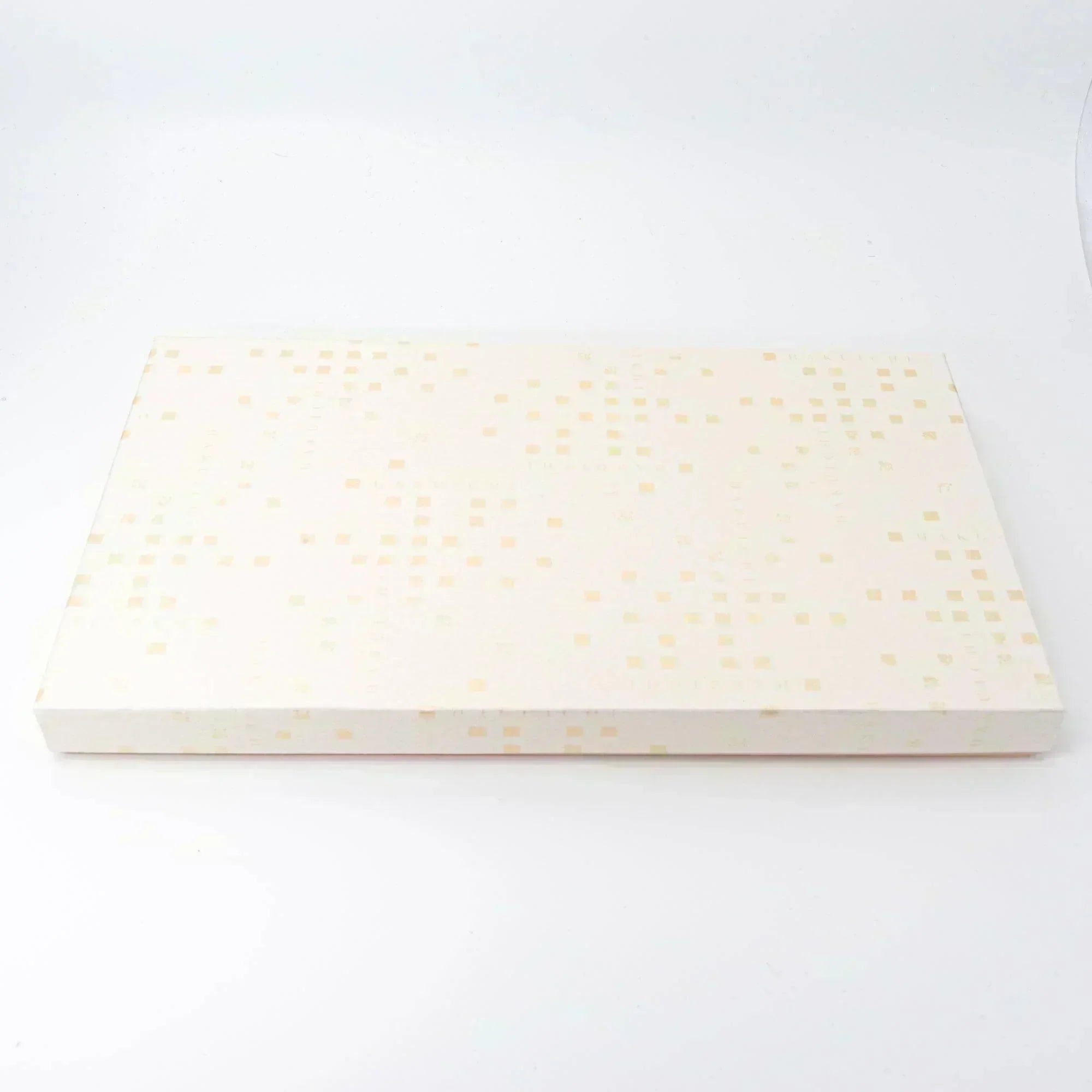 A patterned cream-colored storage box, designed to hold Japanese stationery or other small accessories.