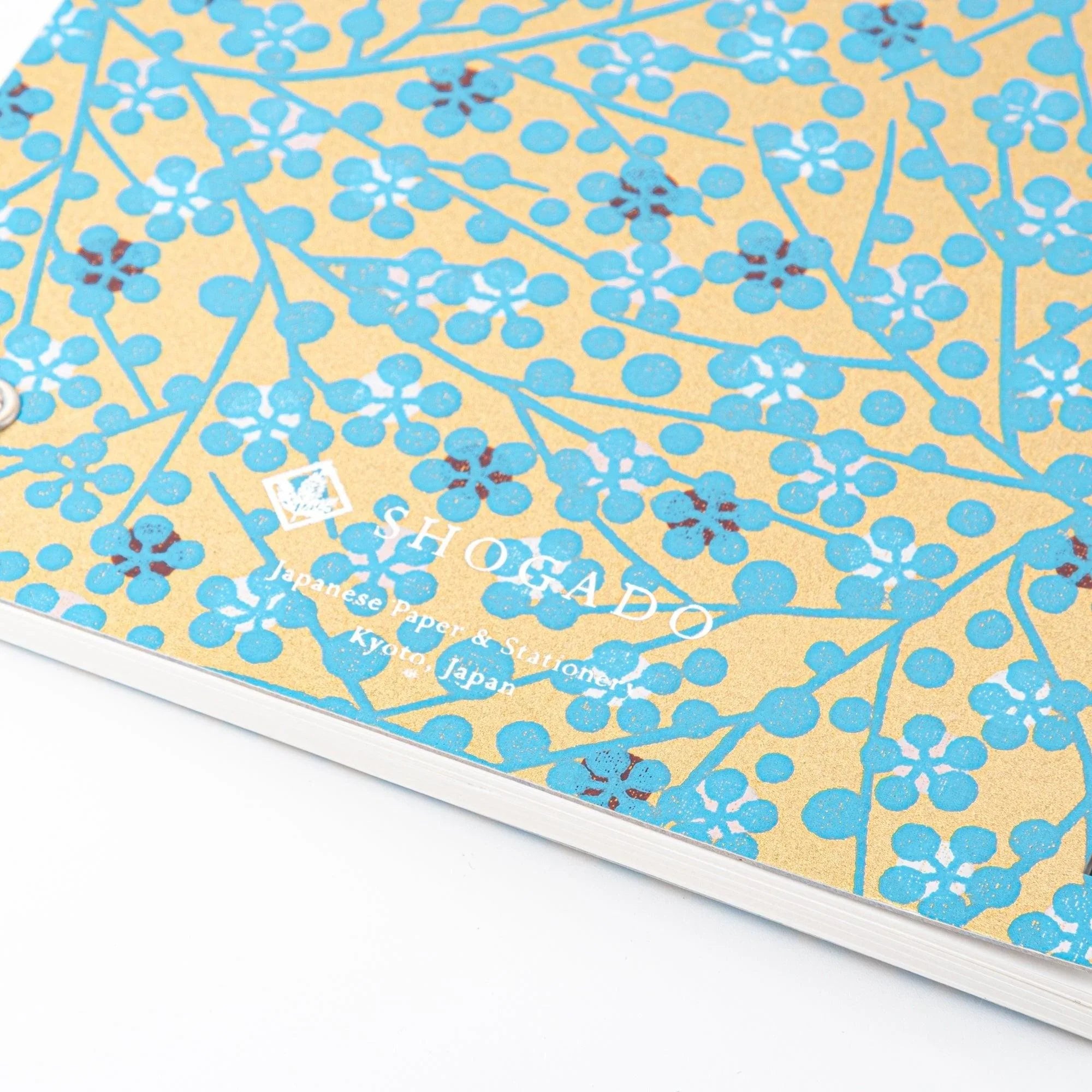 Yuzen washi notebook cover featuring delicate blue flower design demonstrating traditional paper art