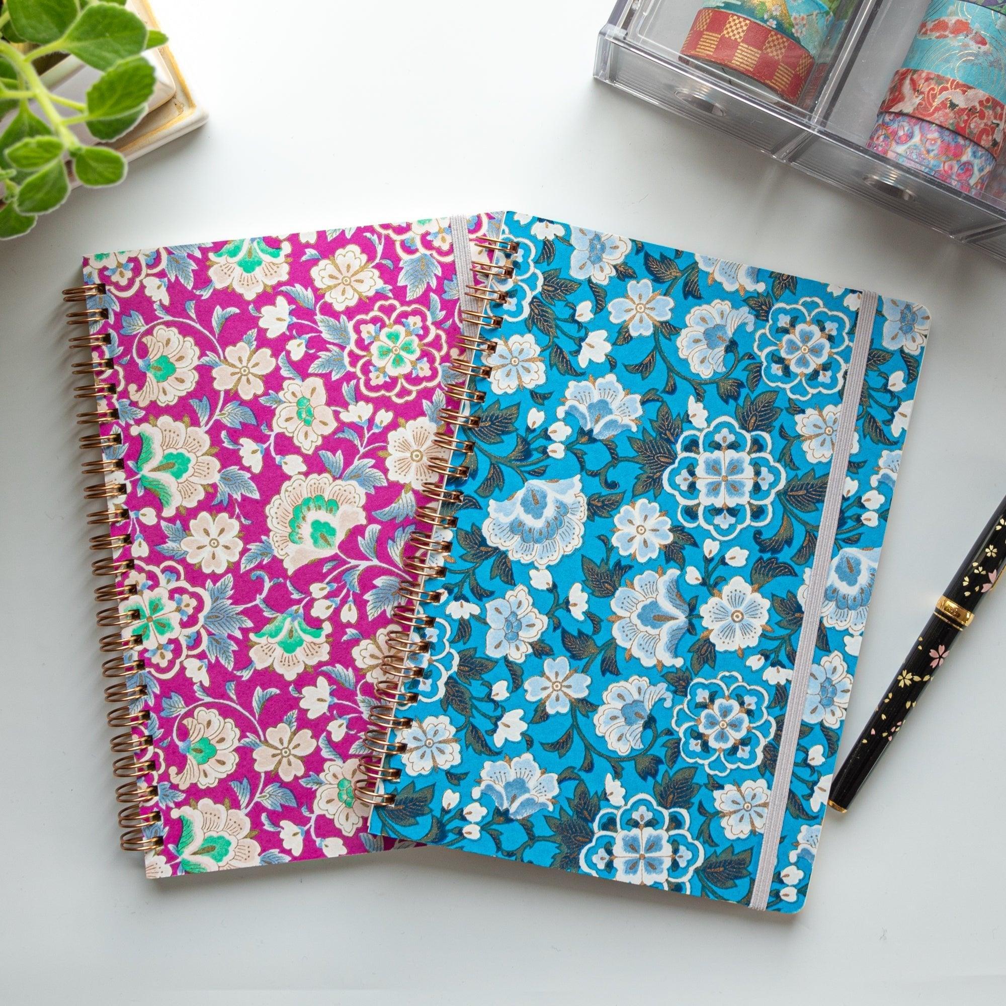 Blue garden Yuzen washi spiral notebook showing hand-dyed pattern with intricate garden-themed floral design