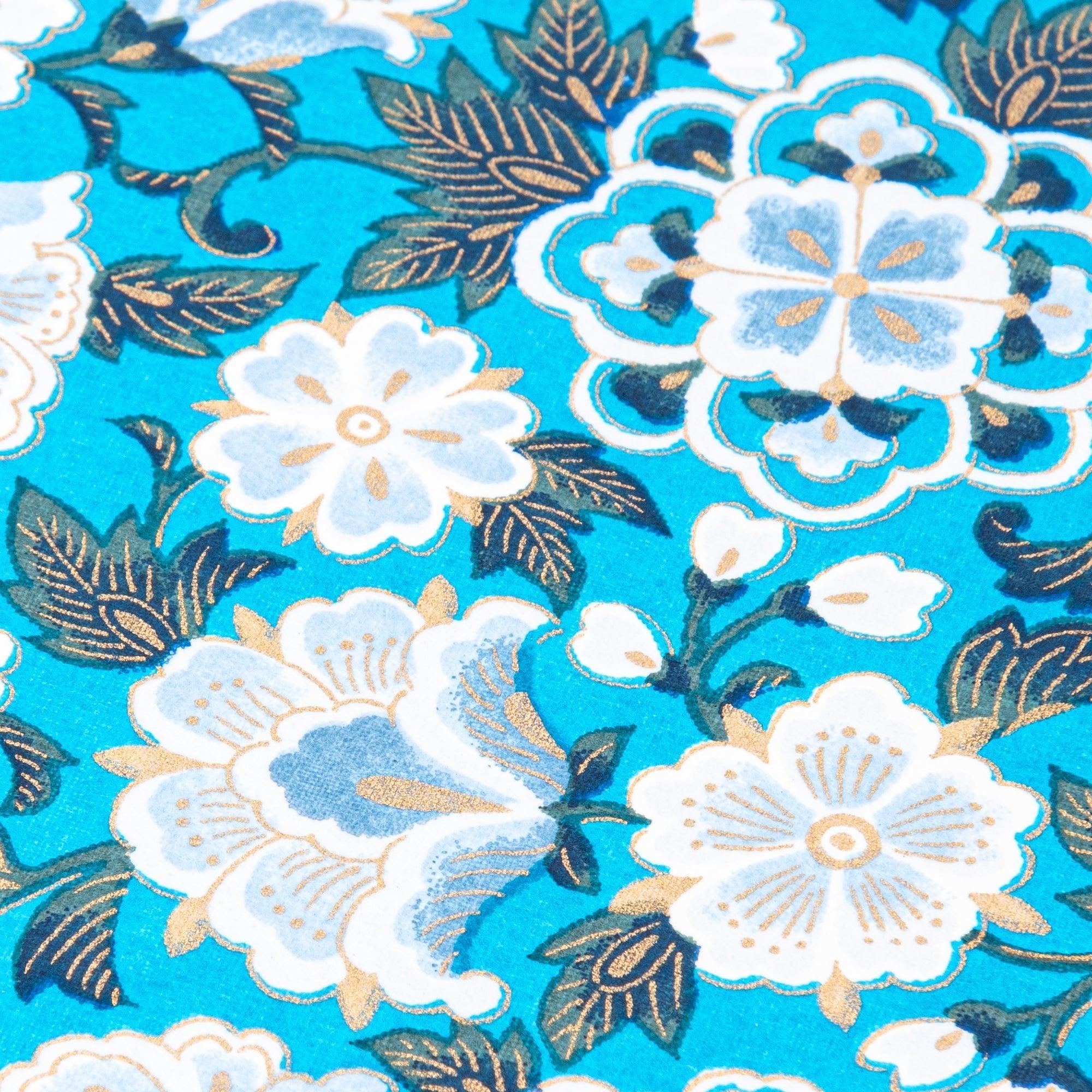 Close-up of blue garden hand-dyed Yuzen washi notebook cover showing intricate floral pattern and texture