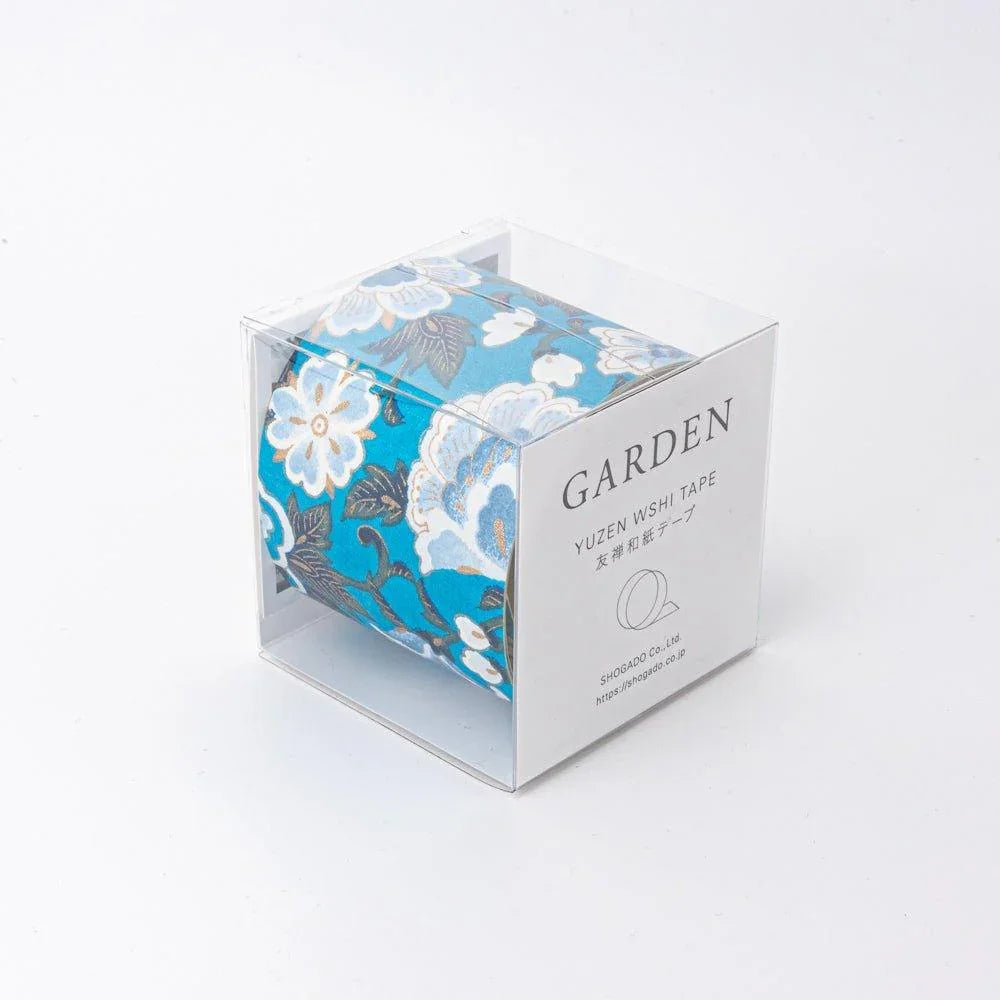 Japanese hand-dyed Yuzen washi tape with blue garden design in cardboard packaging for decorative use