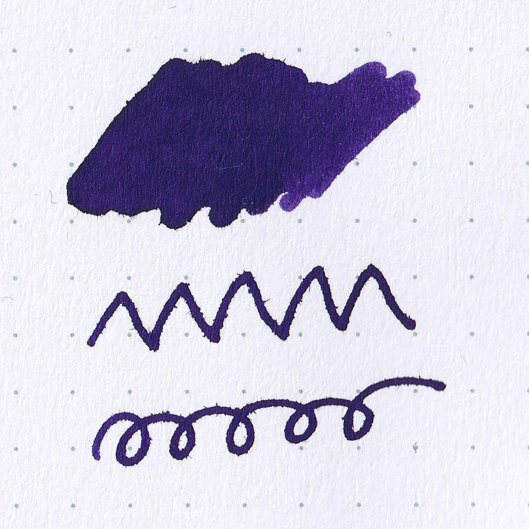 Close-up of Fujiyama Irodori Rin ink bottle, showcasing its rich green ink and elegant label design on a wooden surface.