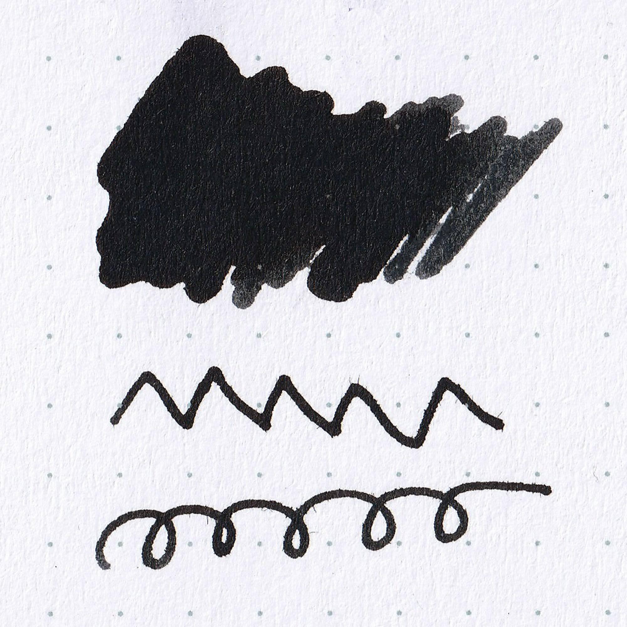 Close-up of Fujiyama Irodori Zen ink bottle, highlighting its elegant gray ink and minimalist label on a wooden surface.