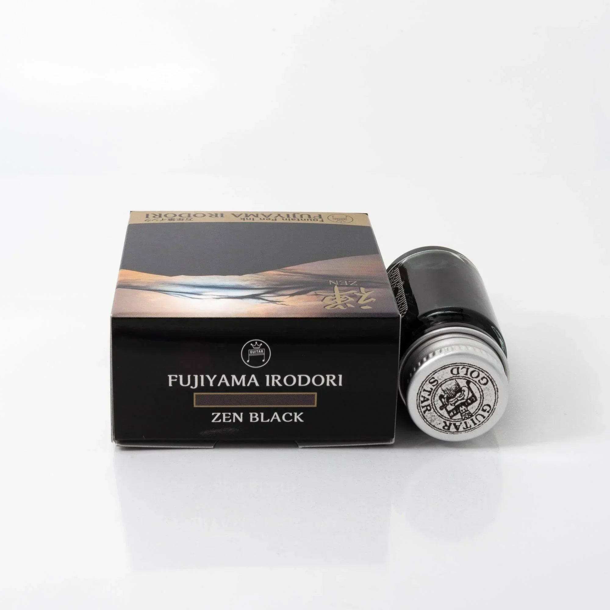 FUJIYAMA IRODORI ZEN green ink bottle arranged with Japanese stationery on styled lifestyle flatlay background