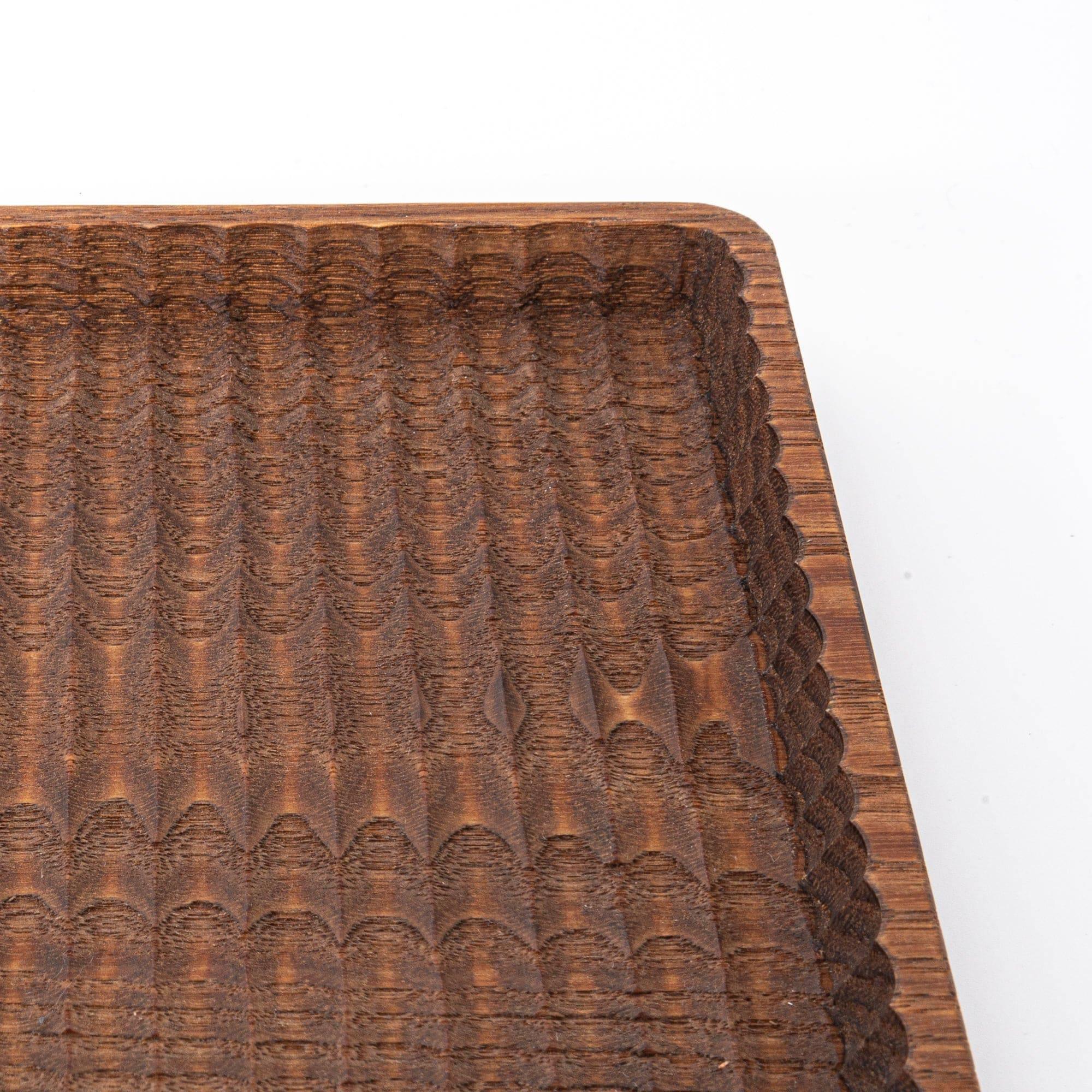 Light wood chestnut pen tray with hand-carved ridge channels and visible wood grain details with clear visibility of design