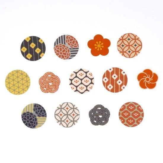 Close-up of individual Japanese-pattern stickers from the bande masking tape, featuring floral and geometric designs in warm colors.