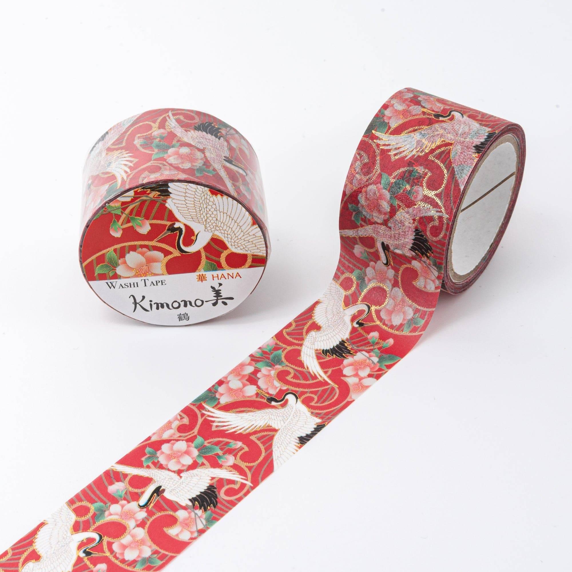 Iyo Washi Tape with traditional crane motifs, elegantly displayed on a wooden surface, emphasizing the blend of art and utility.