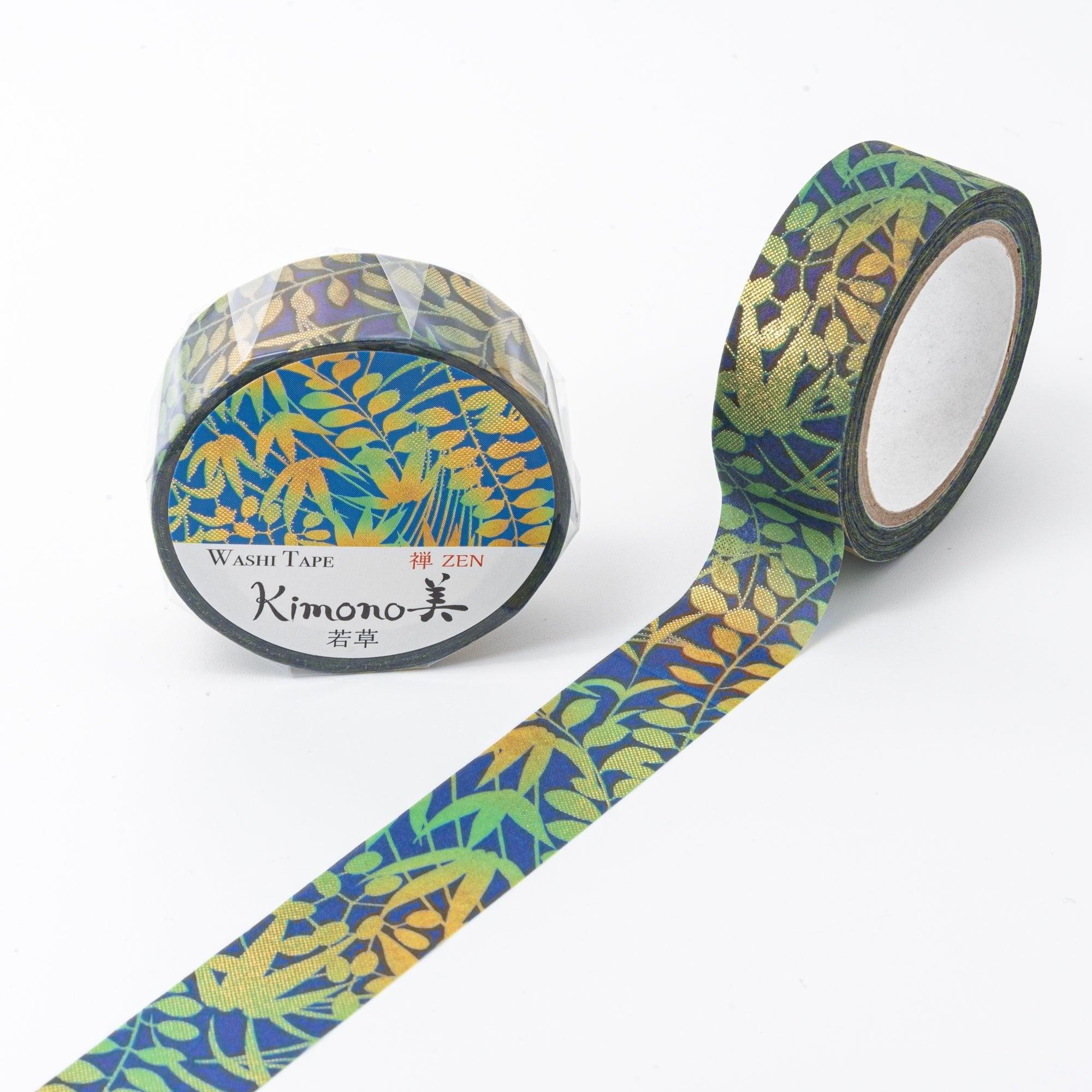 Roll of Iyo Washi Tape with fresh grass patterns, unraveling to reveal its natural motifs, placed on a wooden surface under soft light.