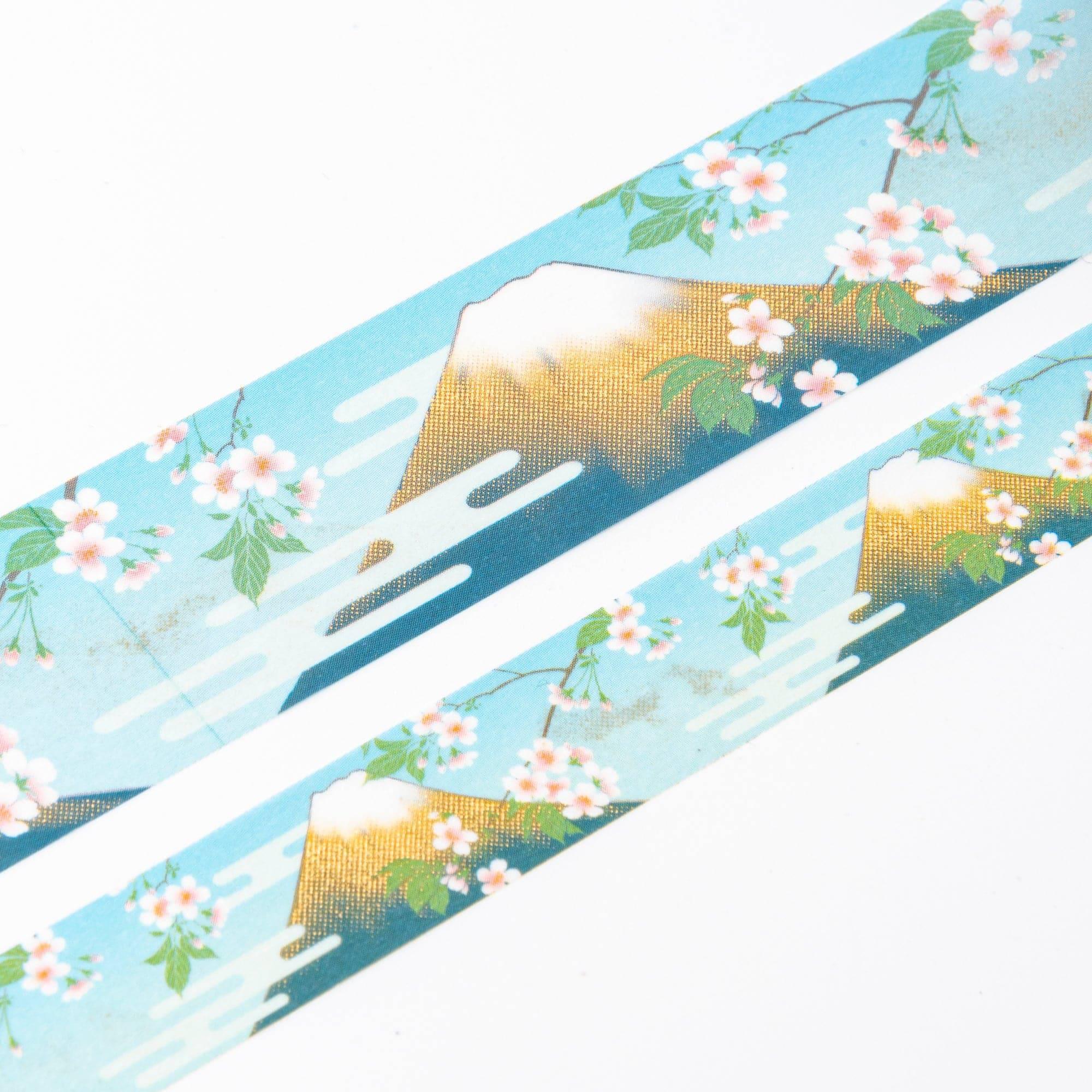Close-up of Iyo Washi Tape showcasing intricate Mt. Fuji designs, with vibrant colors and detailed patterns on a wooden desk.