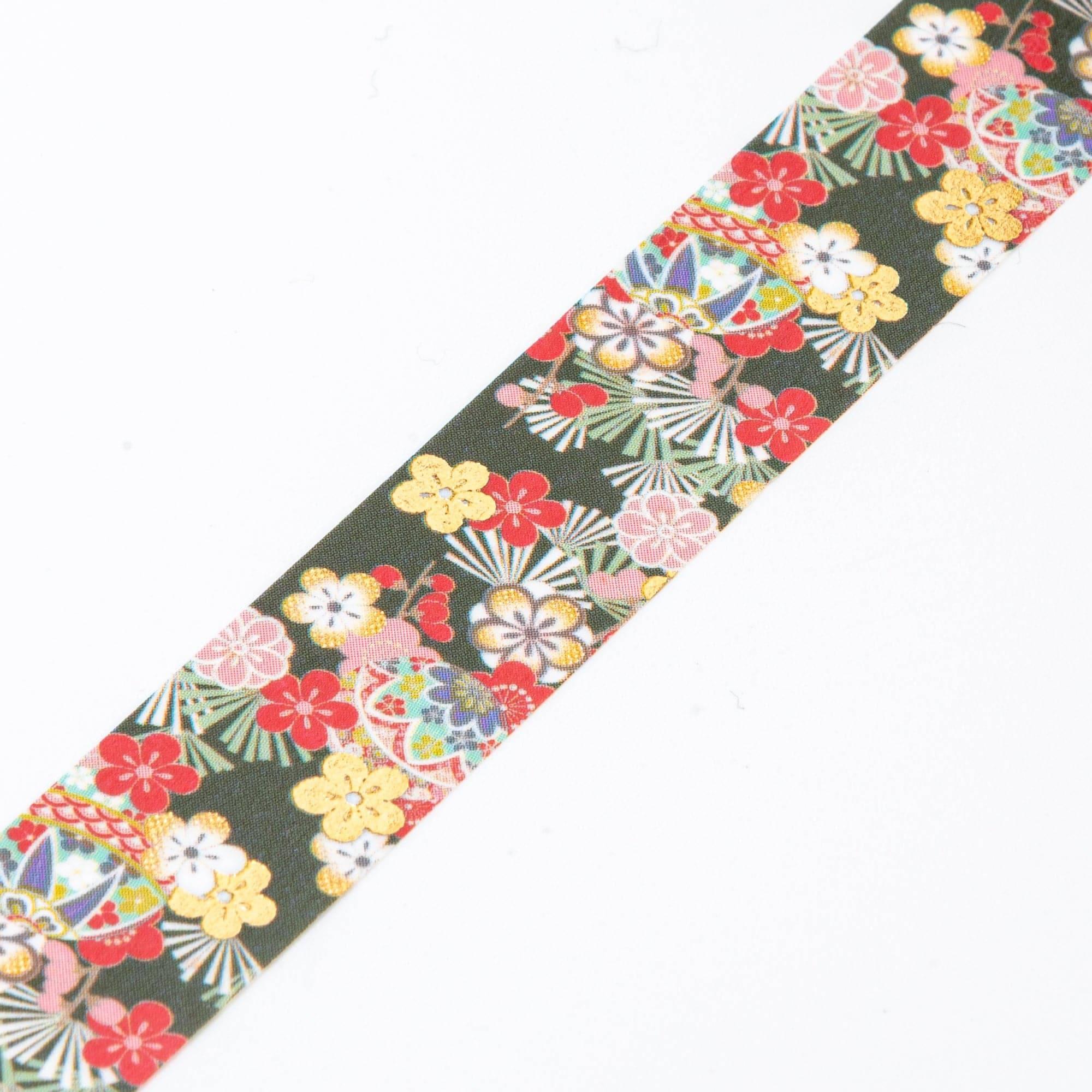 Close-up of Iyo Washi Tape showcasing intricate temari plum patterns, emphasizing vibrant colors and delicate artistry.