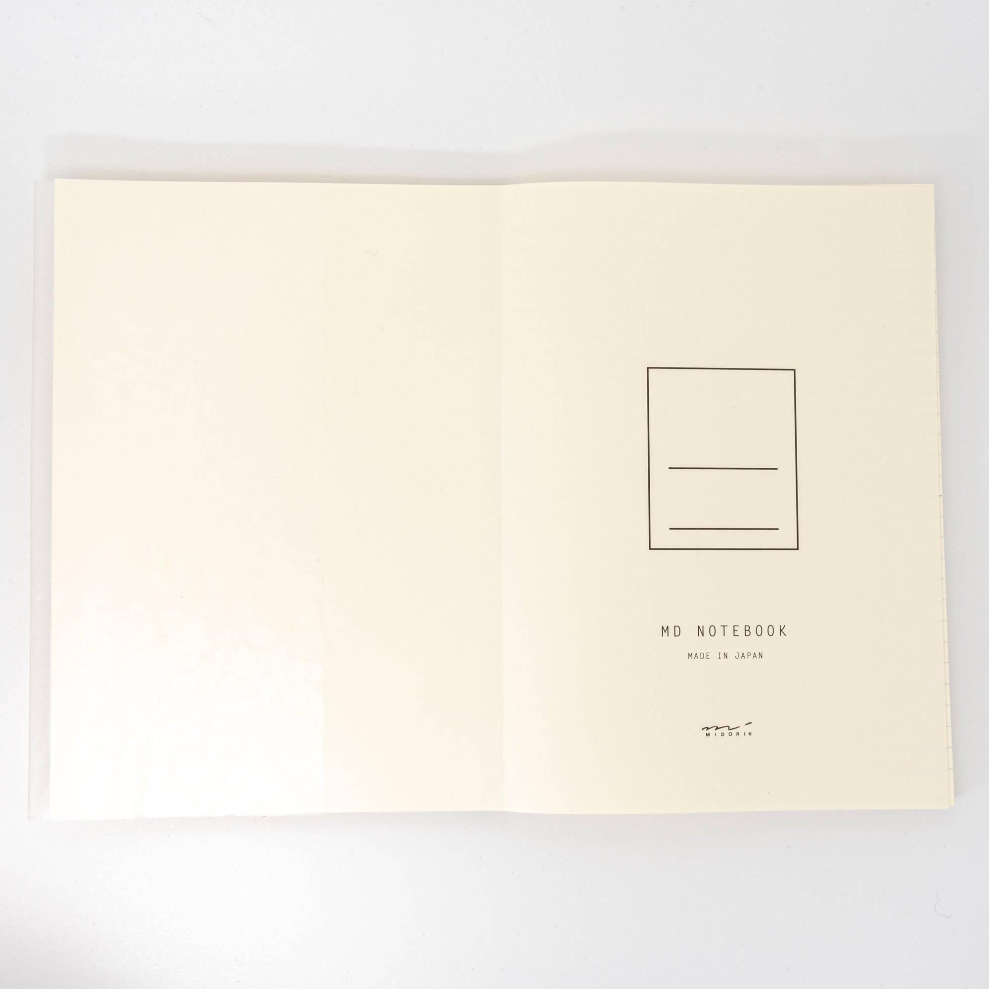 The first page of an MD notebook with a minimal design, highlighting its Japanese stationery craftsmanship.