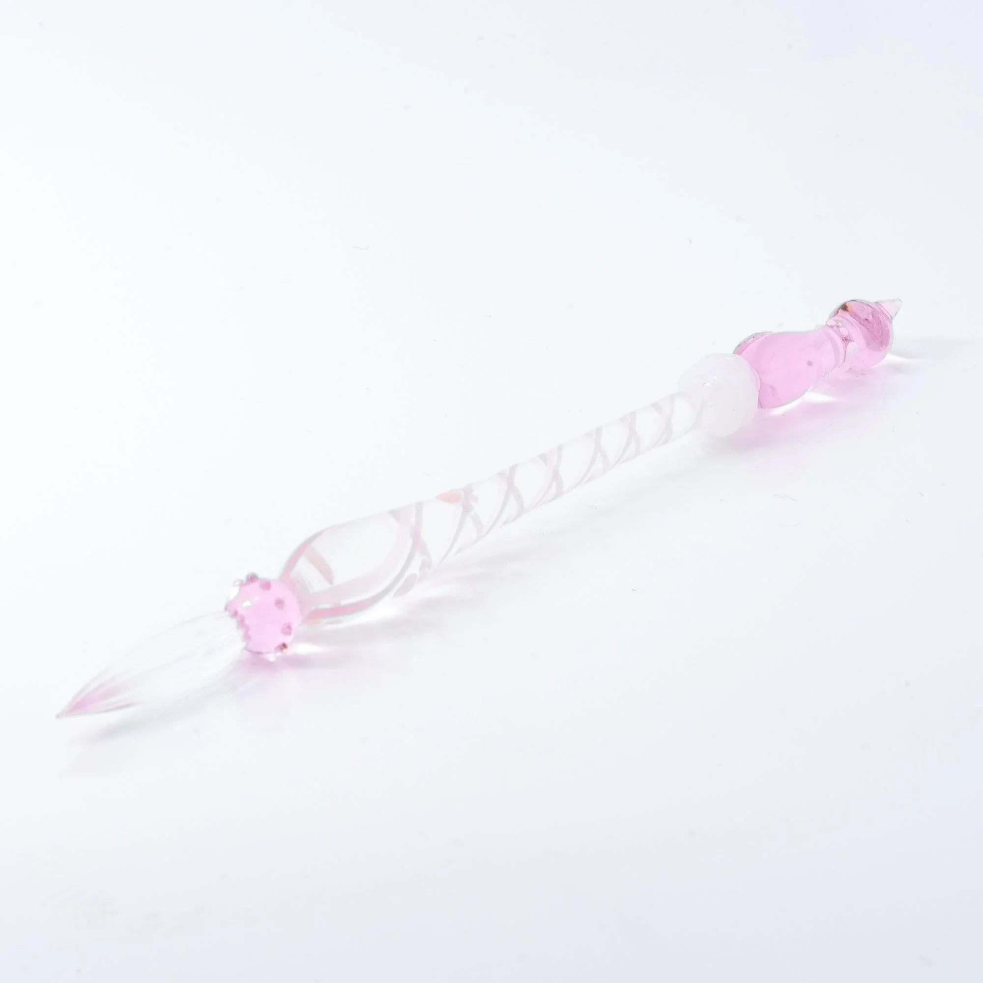 Pink glass dip pen with sitting pink cat at cap, spiral-etched glass handle, white background with handle detail and