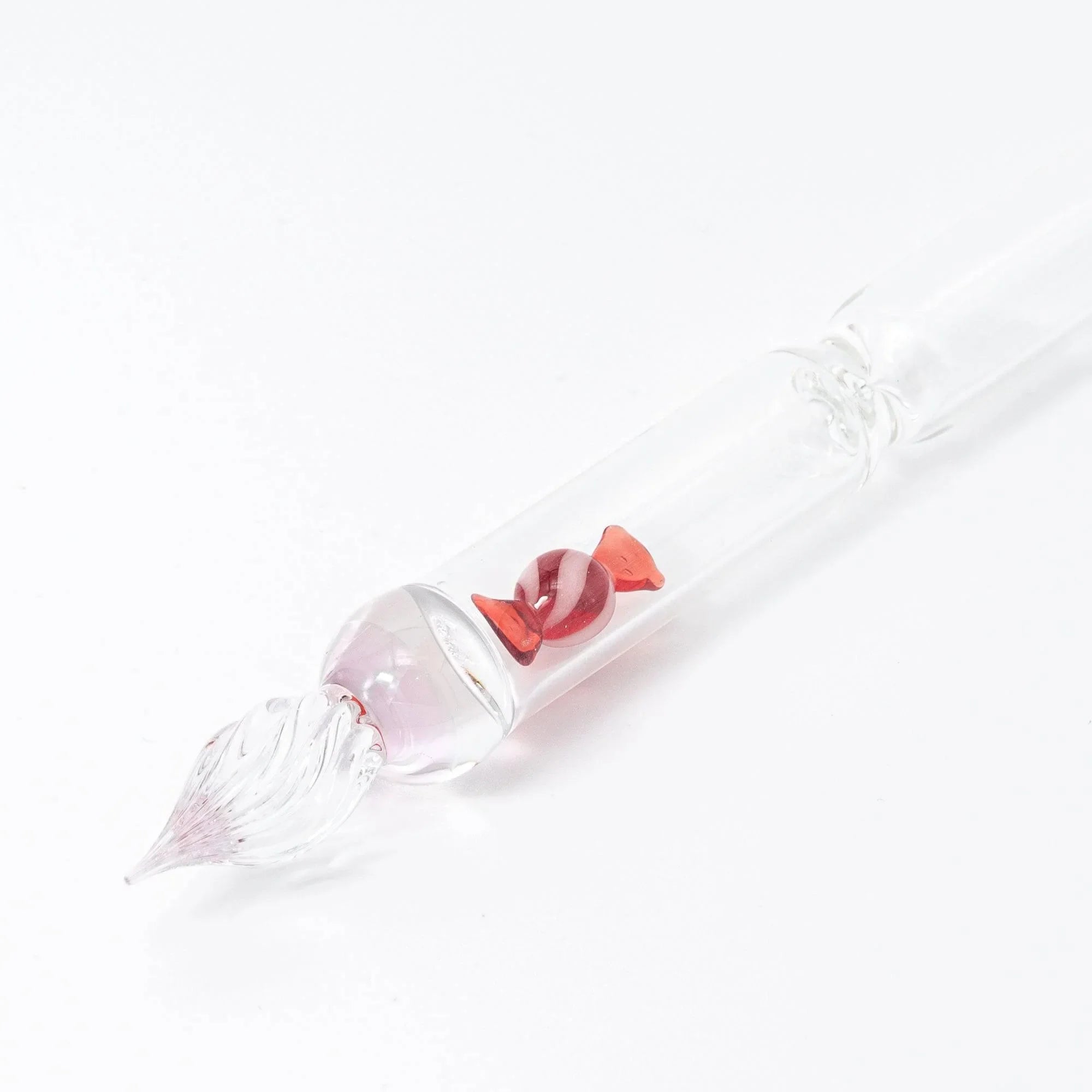 Red Candy glass dip pen in calligraphy use demonstrating smooth ink flow with captured candy details with holder