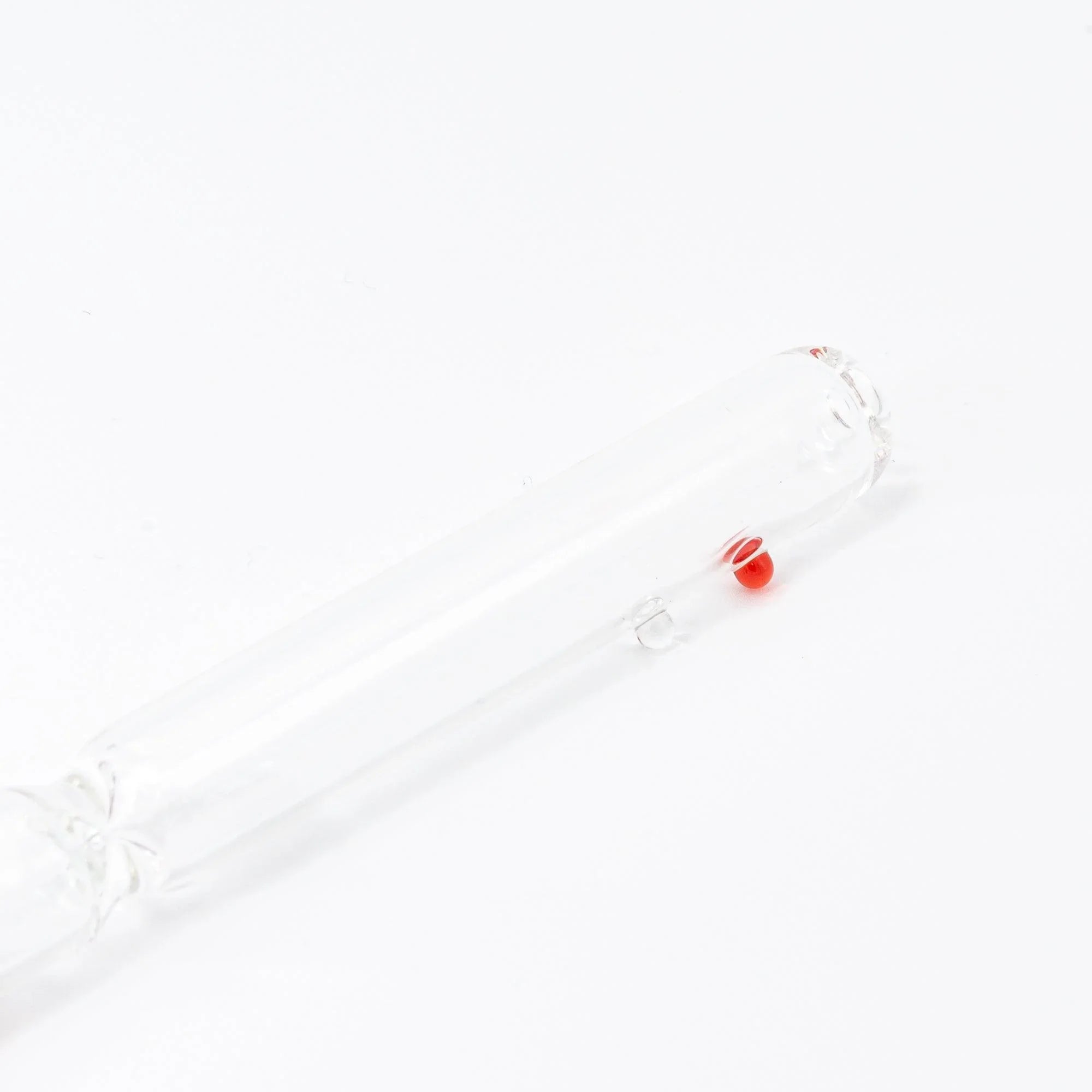 red glass dip pen featuring captured candy bubble inclusions and hand-made twisted design with holder