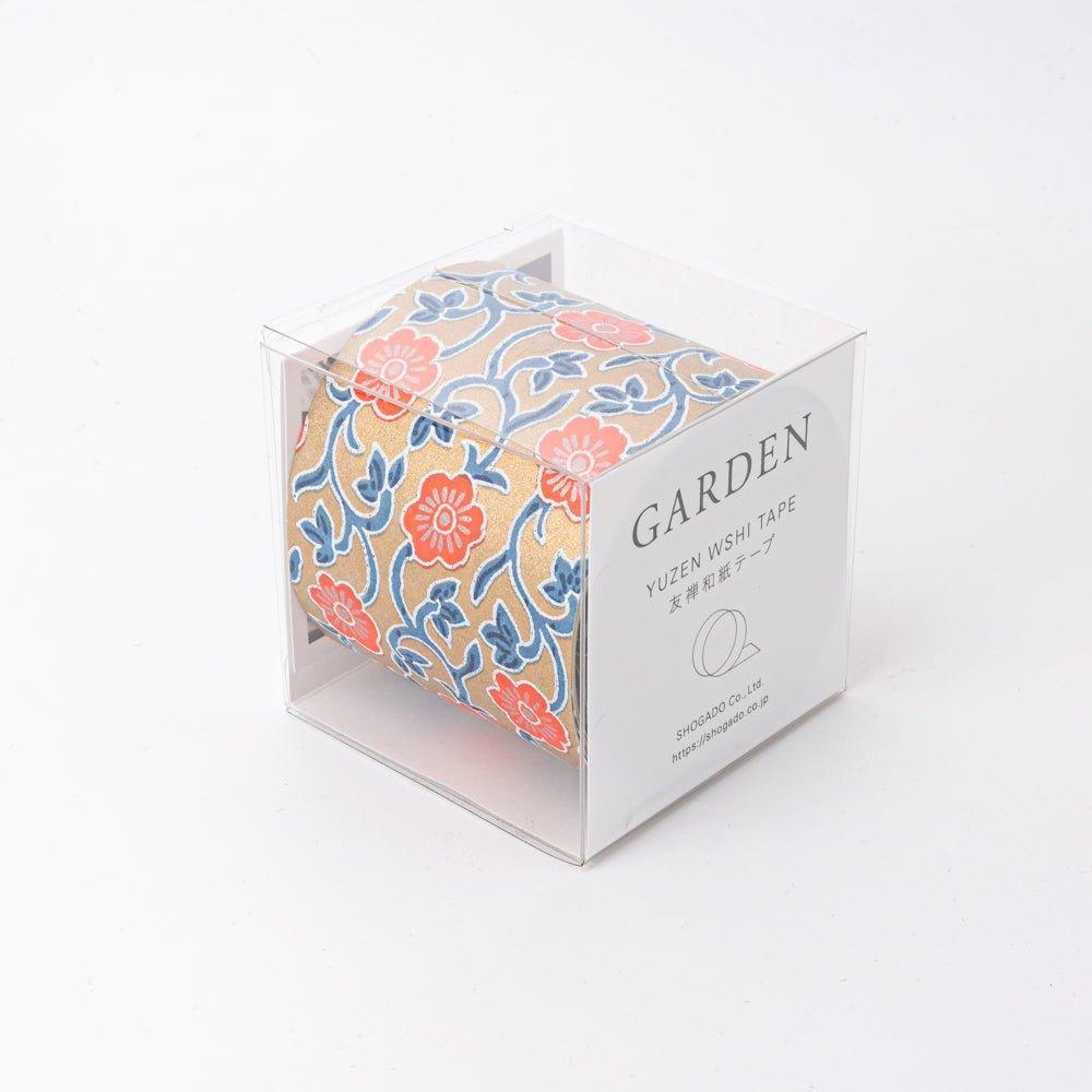Japanese hand-dyed yuzen washi tape in clear acrylic GARDEN box, coral-red plum blossoms on blue arabesque vine over gold