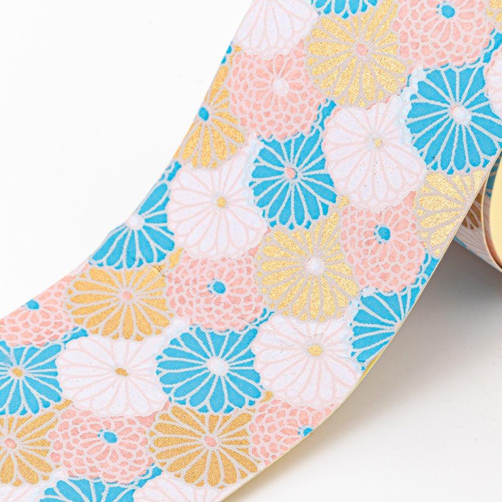 Close-up of Sky Blossom yuzen washi tape showing chrysanthemum in blue, pink, and gold metallic on white background