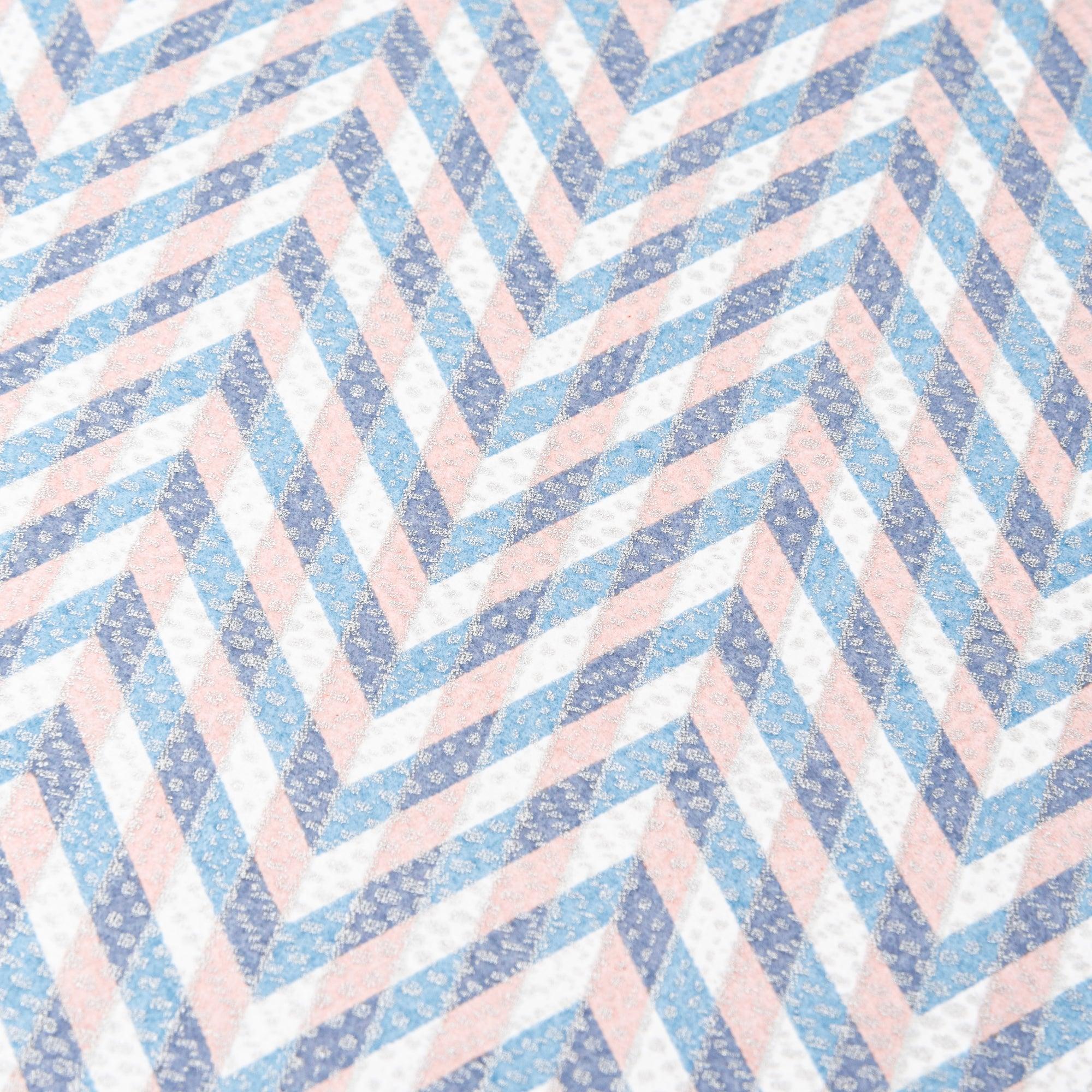Notebook with a blue and pink chevron-patterned cover, screenprinted by hand. Features bleed-proof paper for smooth writing. Made in Japan.