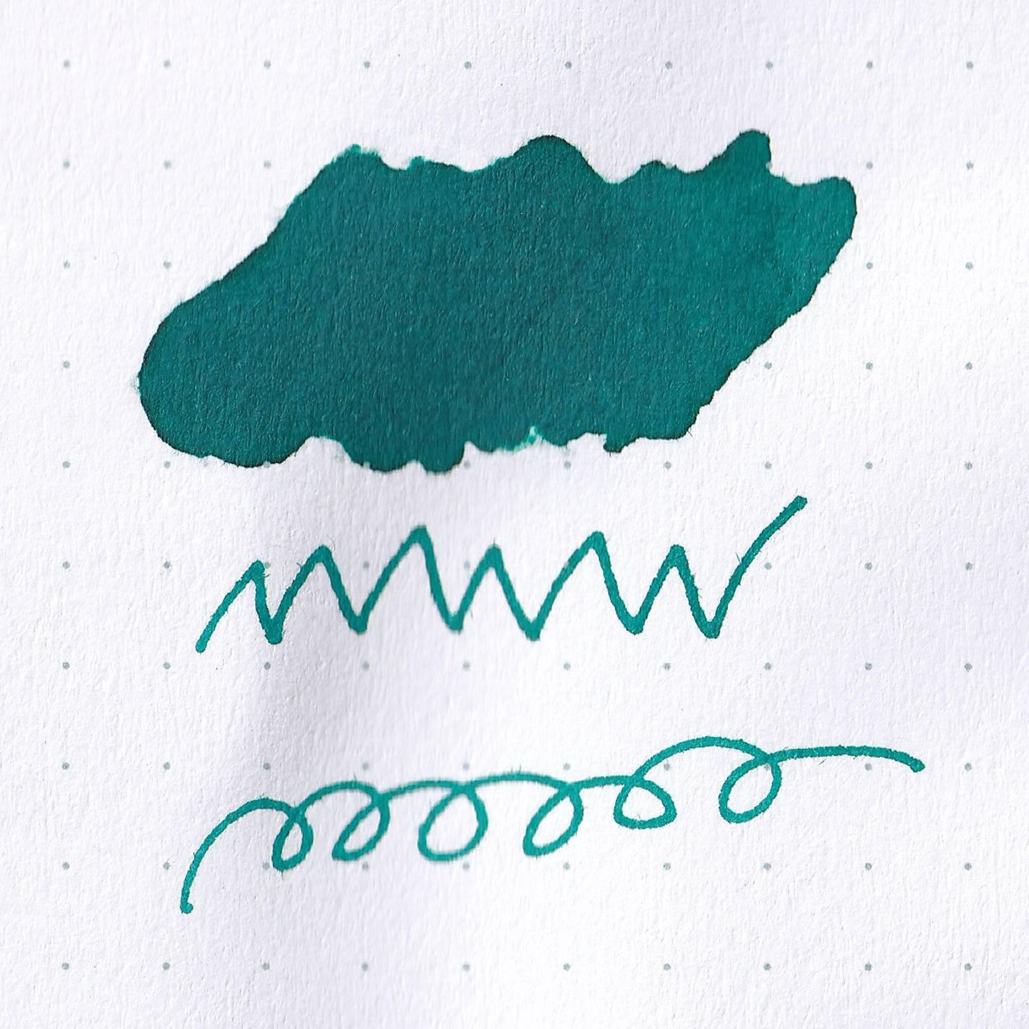 Close-up of Taisho Romance Brilliant Mint ink bottle, showcasing its bright mint ink and vintage-inspired label design.