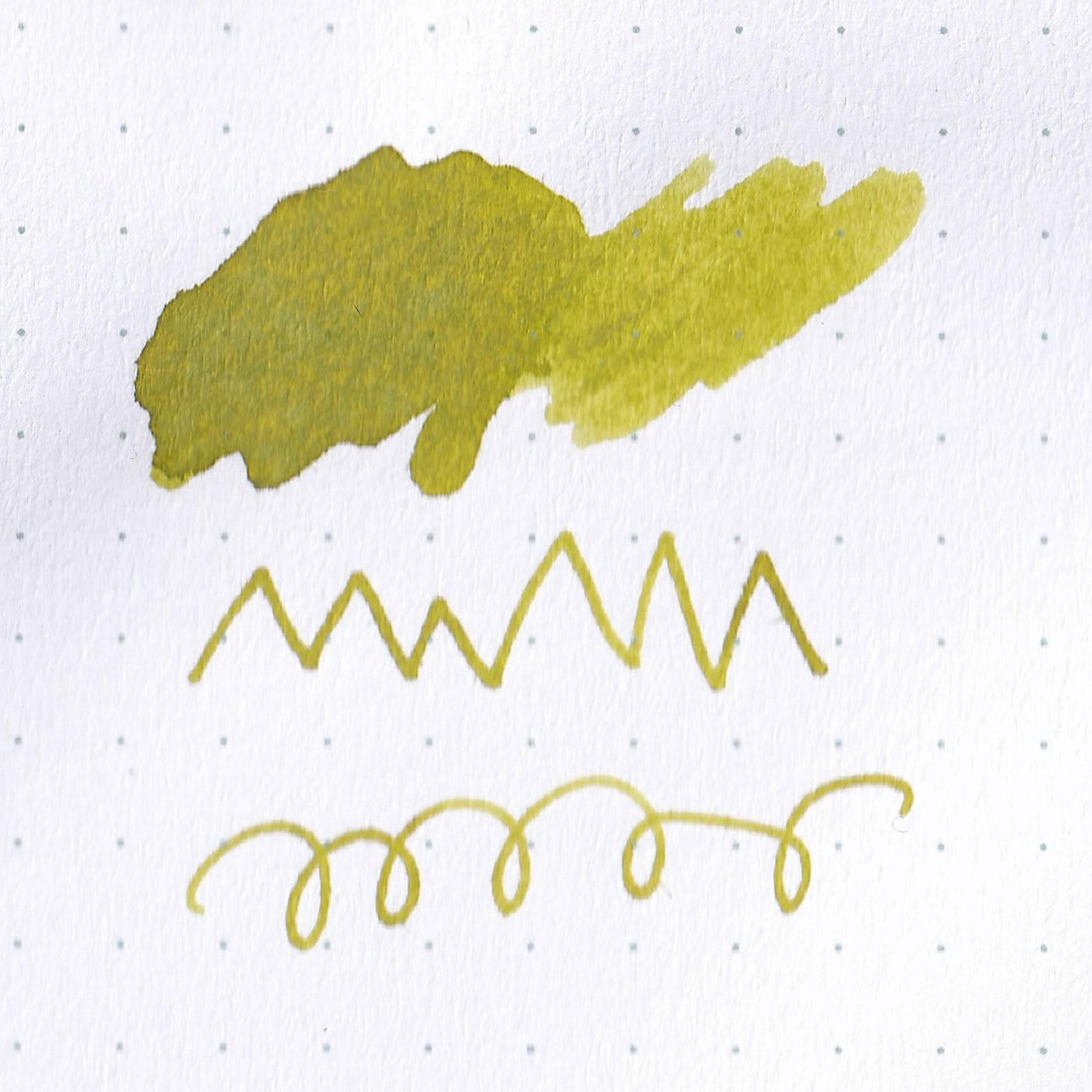 Close-up of Taisho Romance Emotional Olive ink bottle, showcasing its subtle olive ink and vintage-inspired label design.