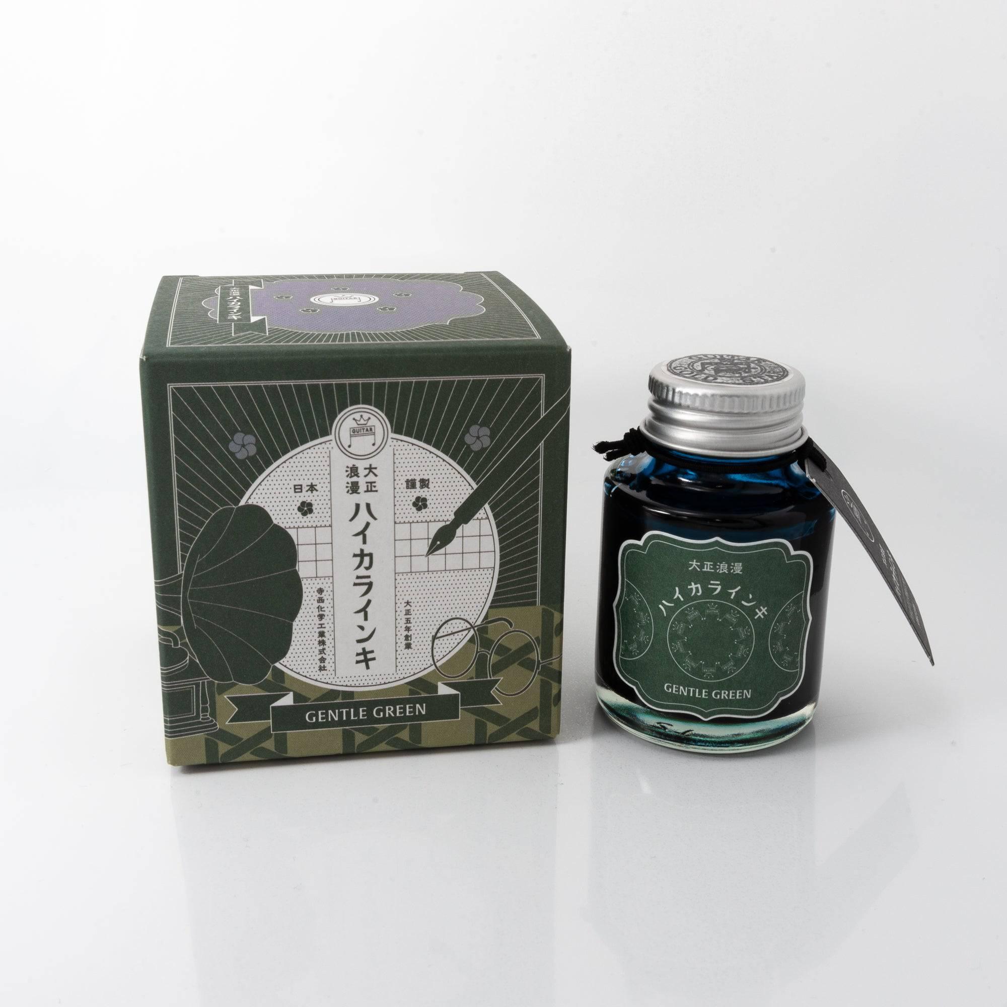Taisho Romance Gentle Green fountain pen ink bottle with a soft green hue, placed on a wooden desk under warm natural light.