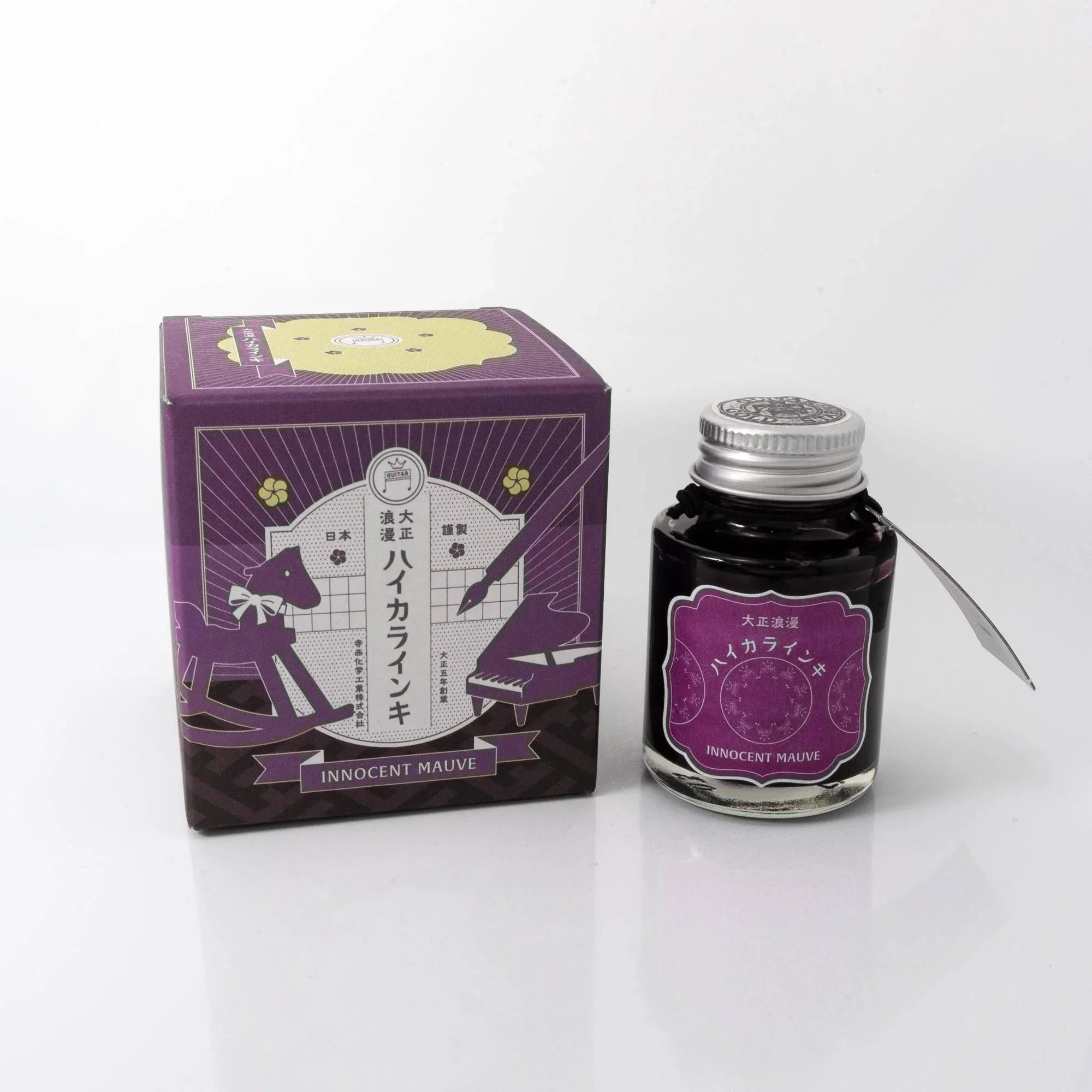 Taisho Romance Innocent Mauve fountain pen ink in glass bottle displayed frontally setup, from Japan, Japanese ink brand
