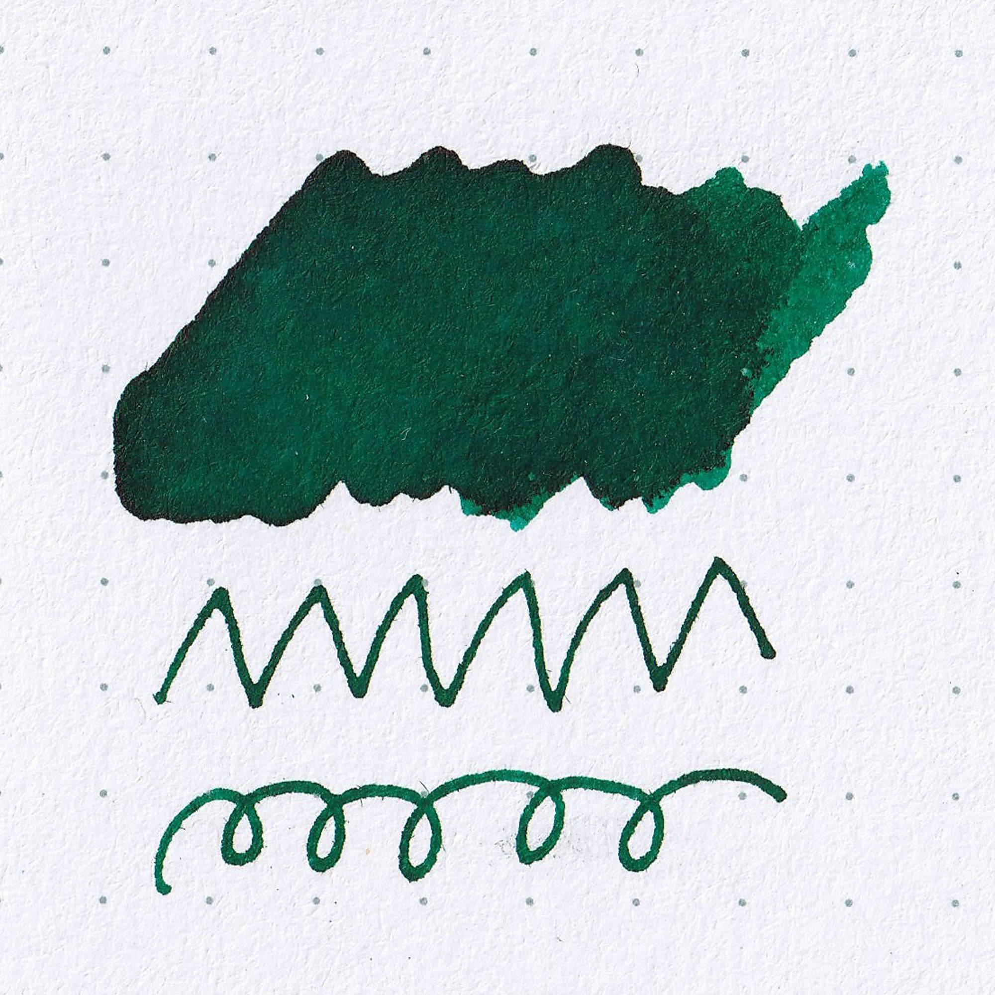 Close-up of Taisho Romance Lady Emerald ink bottle, showcasing its vibrant green ink and vintage-inspired label design.