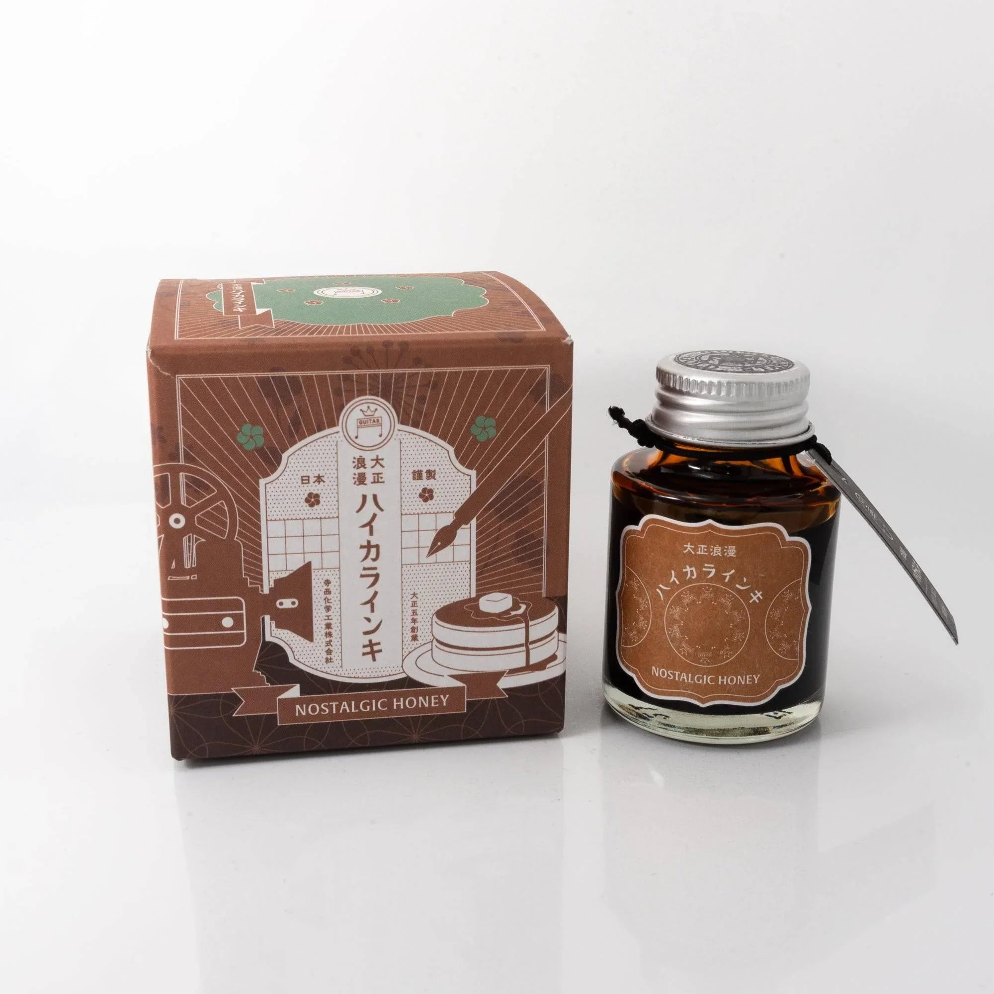 Taisho Romance Nostalgic Honey fountain pen ink bottle and black box with warm honey-tone accents displayed