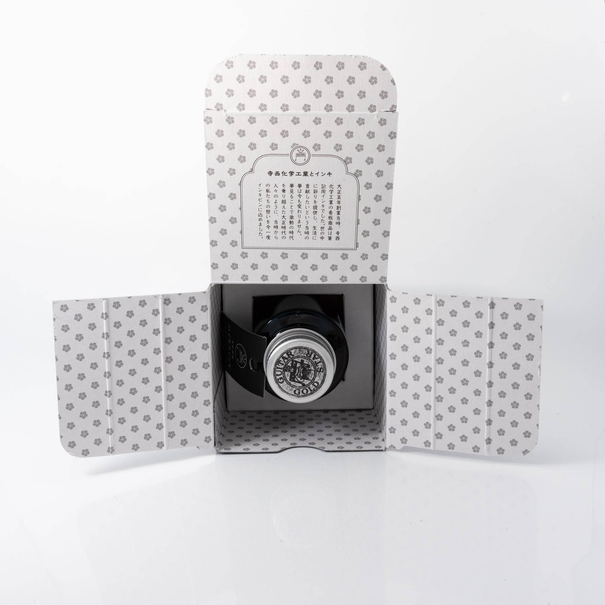 An open box of "NOSTALGIC HONEY" ink with a patterned interior and product story, highlighting its Japanese stationery heritage.