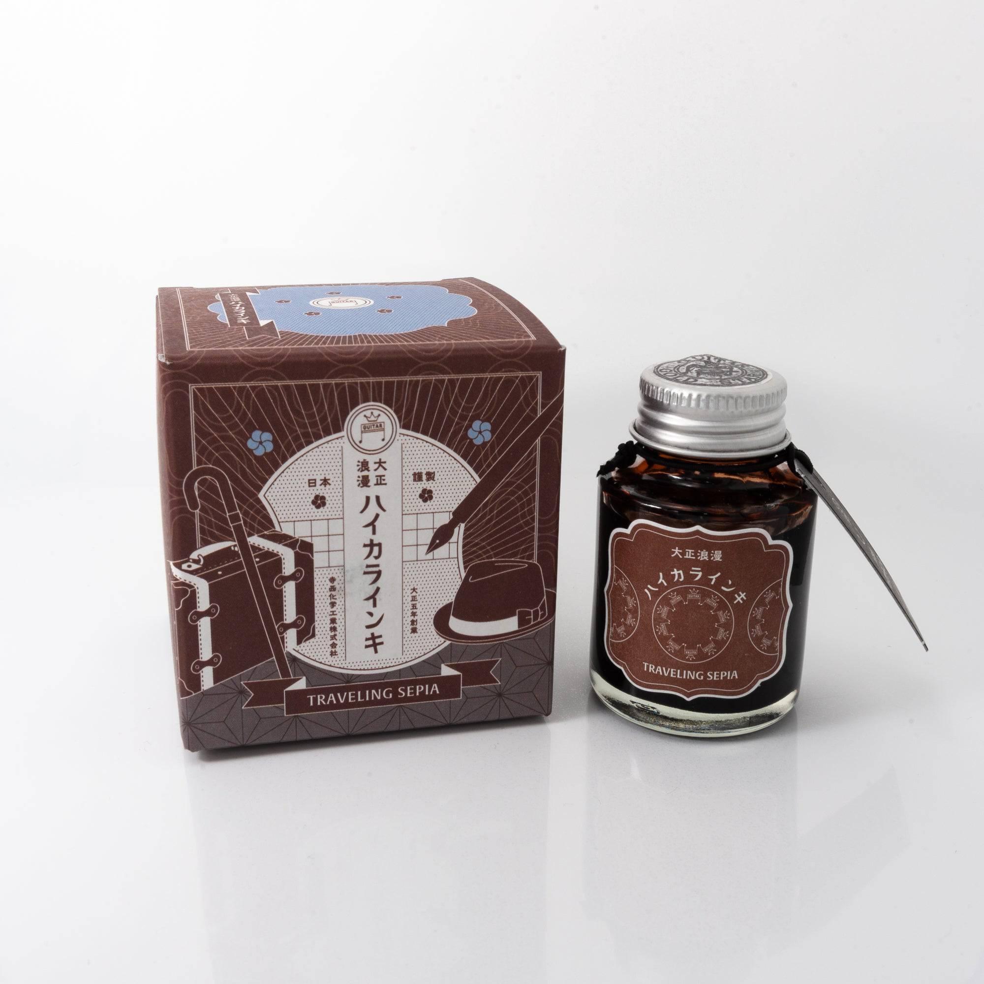 Taisho Romance Traveling Sepia fountain pen ink bottle with a warm sepia hue, placed on a wooden desk under soft natural light.
