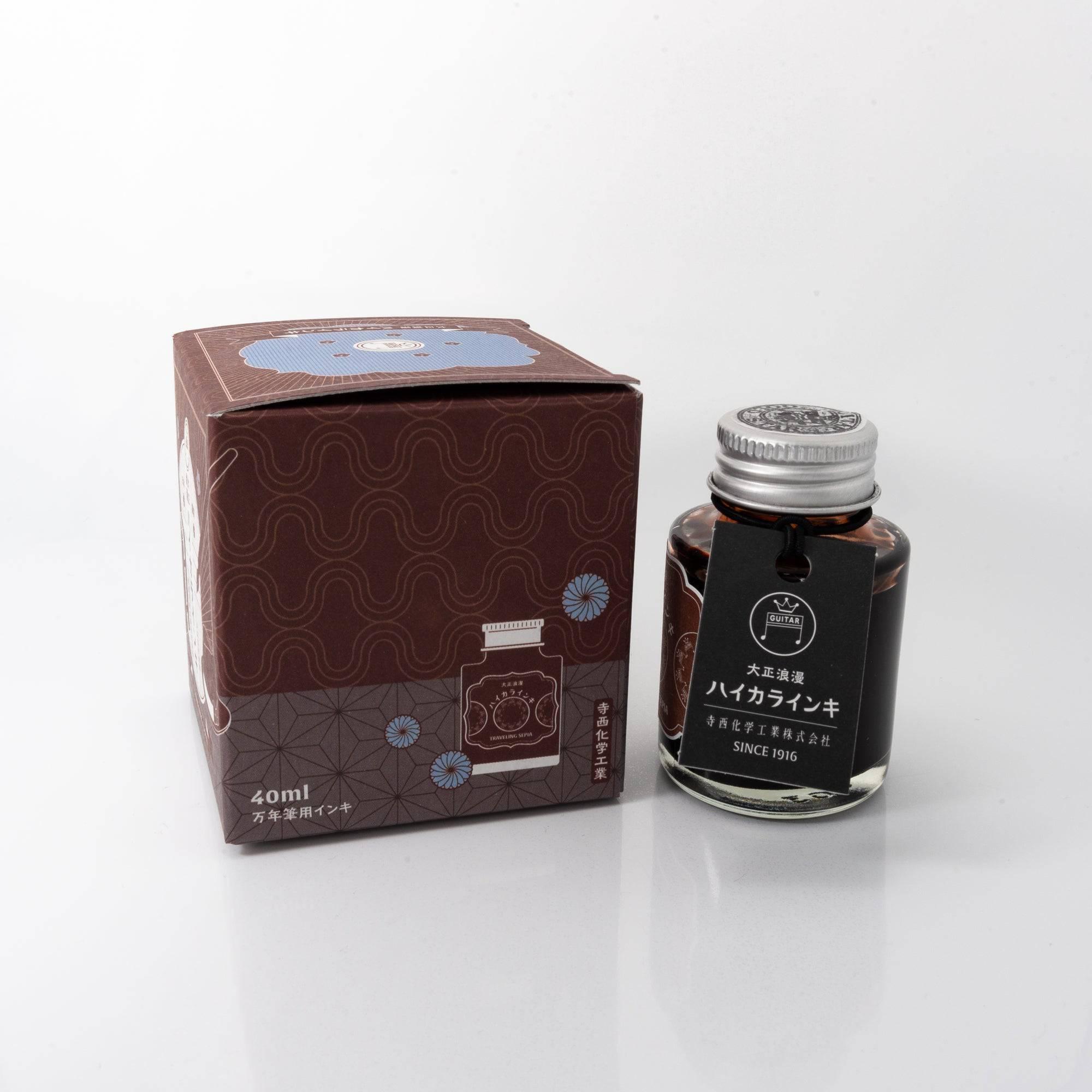 Open Taisho Romance Traveling Sepia ink bottle with rich sepia liquid, placed beside a fountain pen, blending style and functionality.