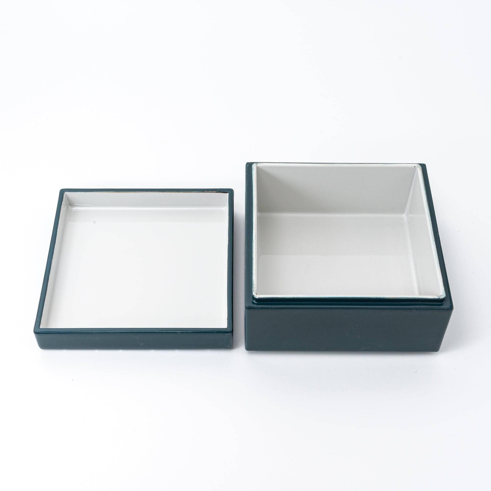 Open green Japanese lacquer stationery box with a white interior, separated into lid and base, displayed against a white background with a minimalist design.