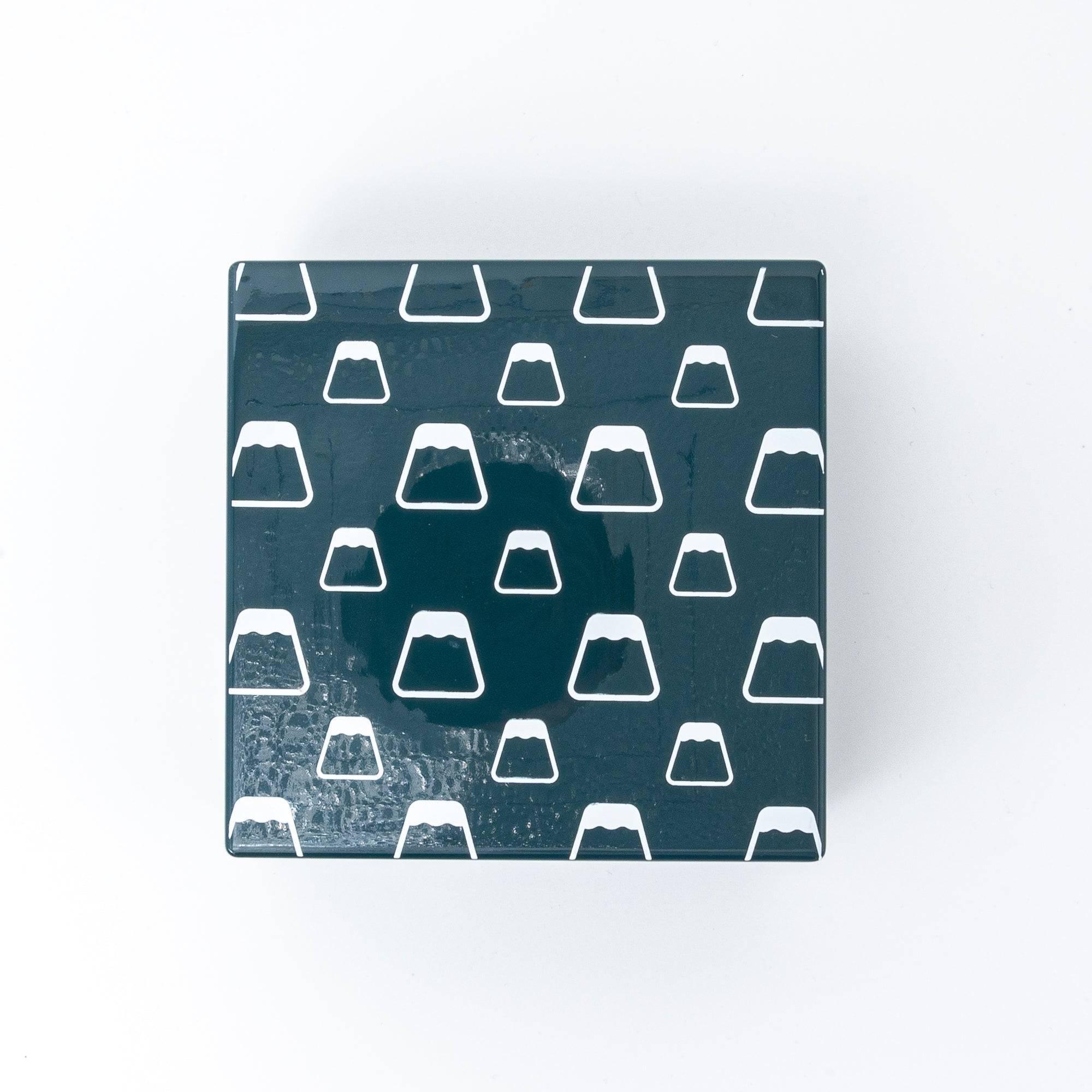 Top view of a green Japanese lacquer stationery box with white Mount Fuji patterns, showcasing its glossy surface and neatly arranged decorative design.