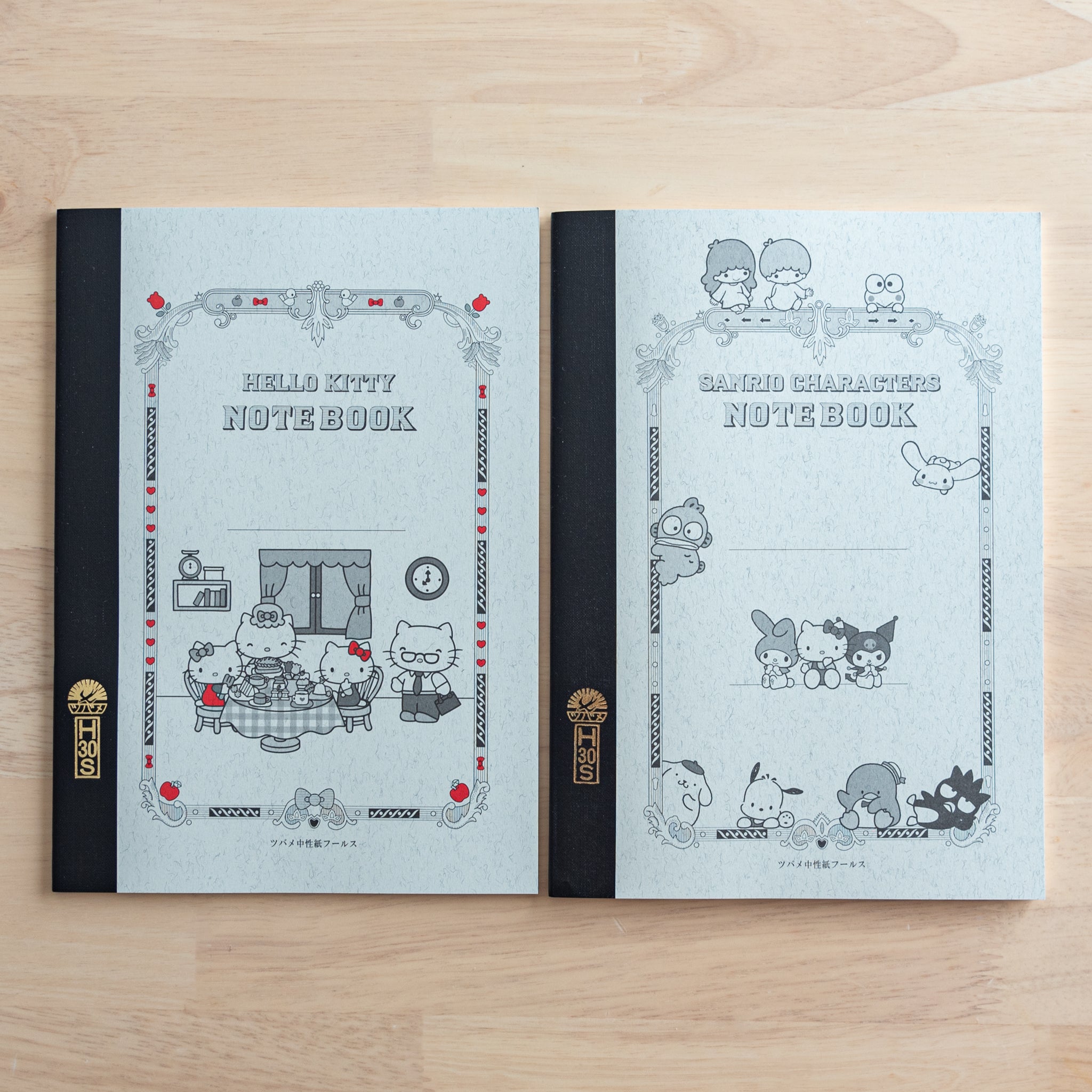 Two Tsubame Japanese notebooks with Sanrio designs, featuring Hello Kitty and other characters on ornate covers with black spines and red accents, blending elegance and cuteness.  