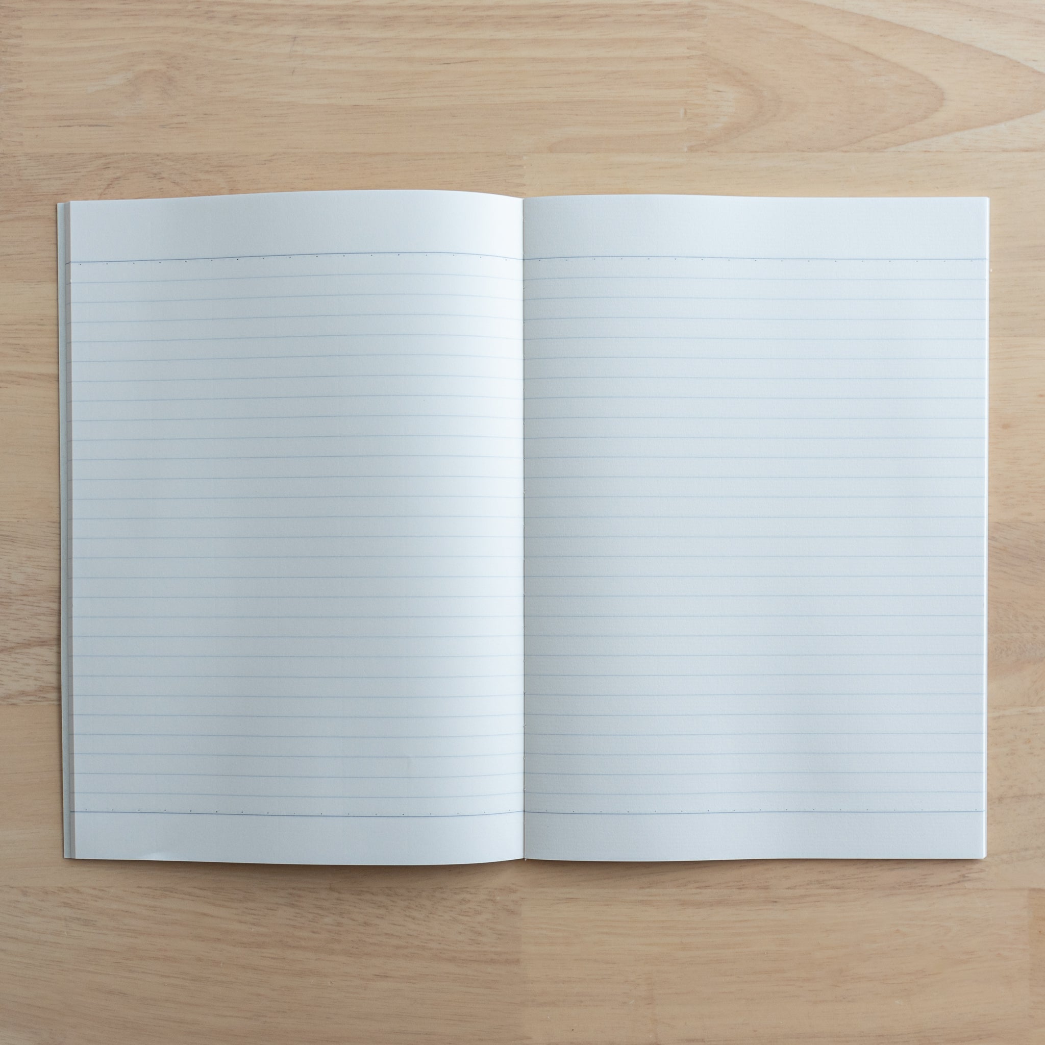 A fully opened Tsubame Japanese notebook with two lined pages, featuring high-quality, acid-free paper designed for smooth writing, representing fine Japanese stationery.  