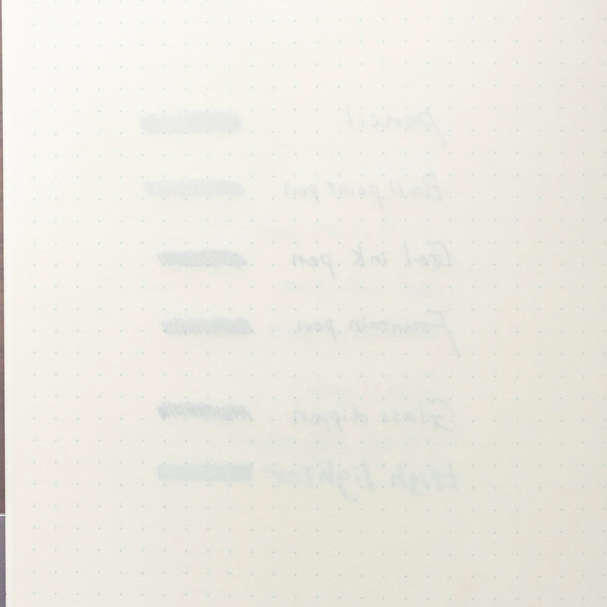 Reverse side of Midori MD Notebook dot grid page showing minimal bleed-through from pen compatibility test on other side