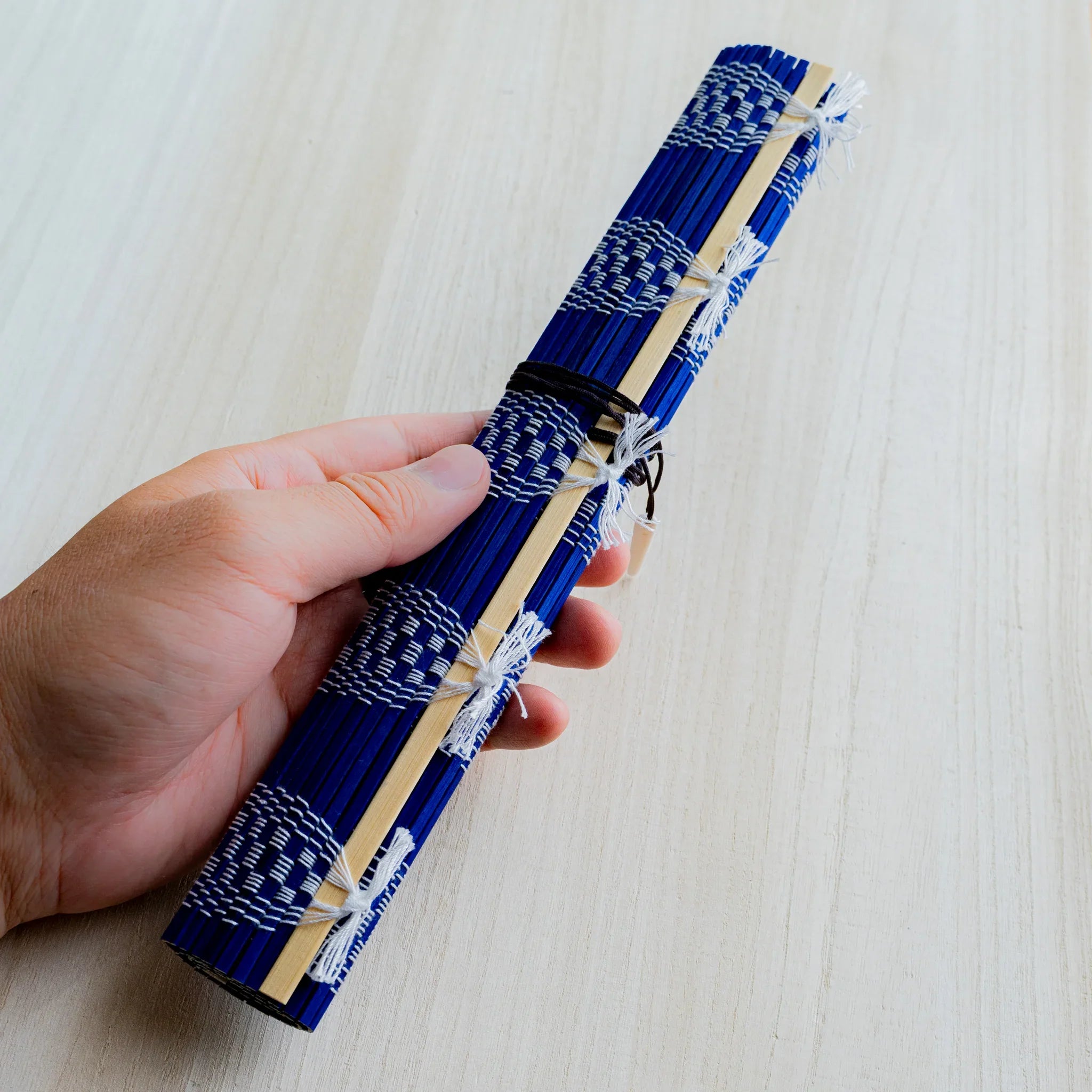 Akashiya bamboo brush holder roll, blue, close-up of the checkered weave detail