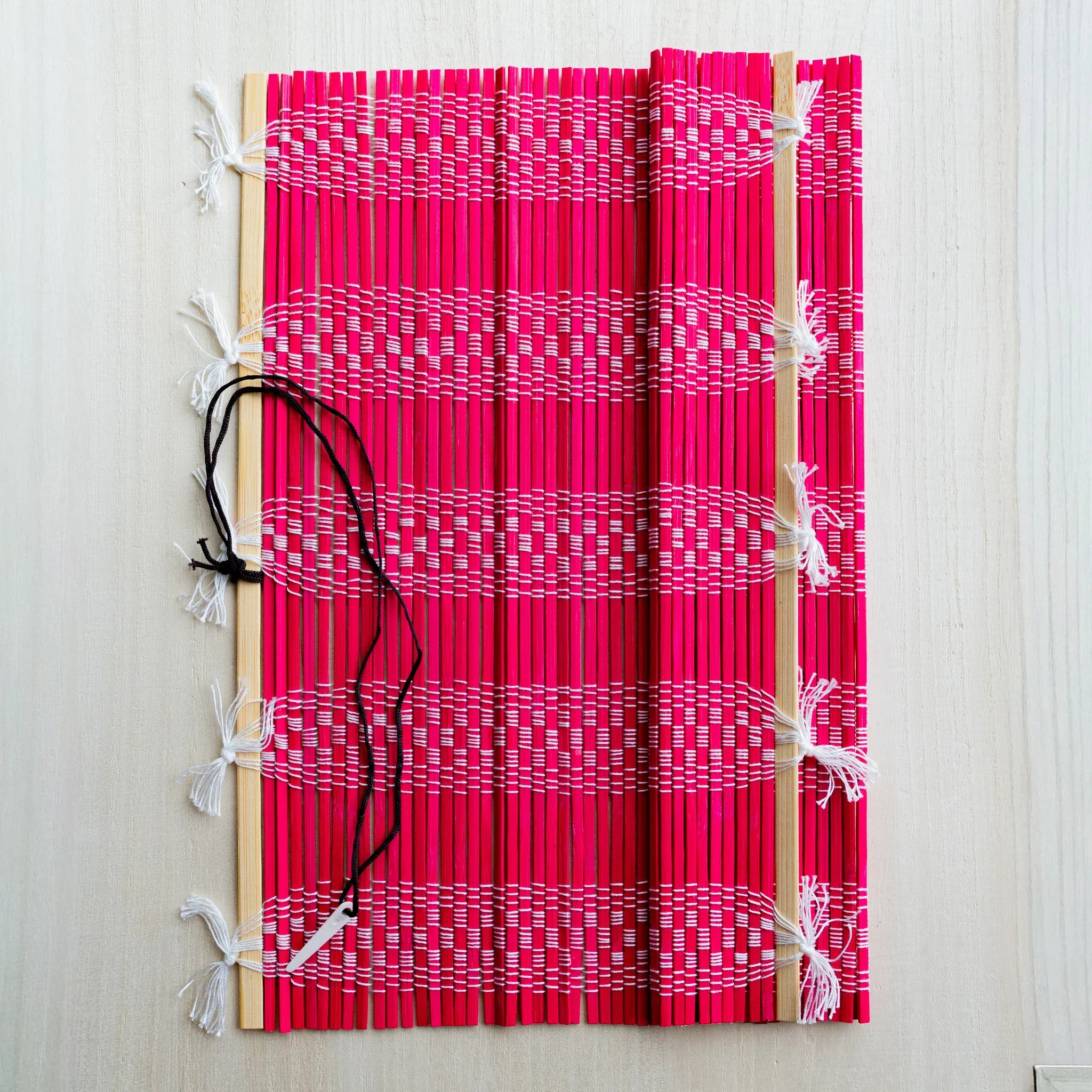 Akashiya bamboo brush holder roll, red, close-up of the woven bamboo strips