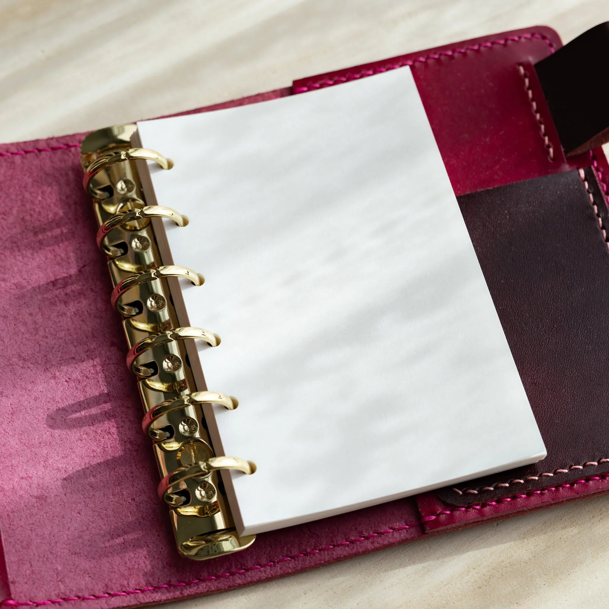 Japanese stationery Mini 6 ring planner refill with blank bank paper pages set in a leather binder with gold rings