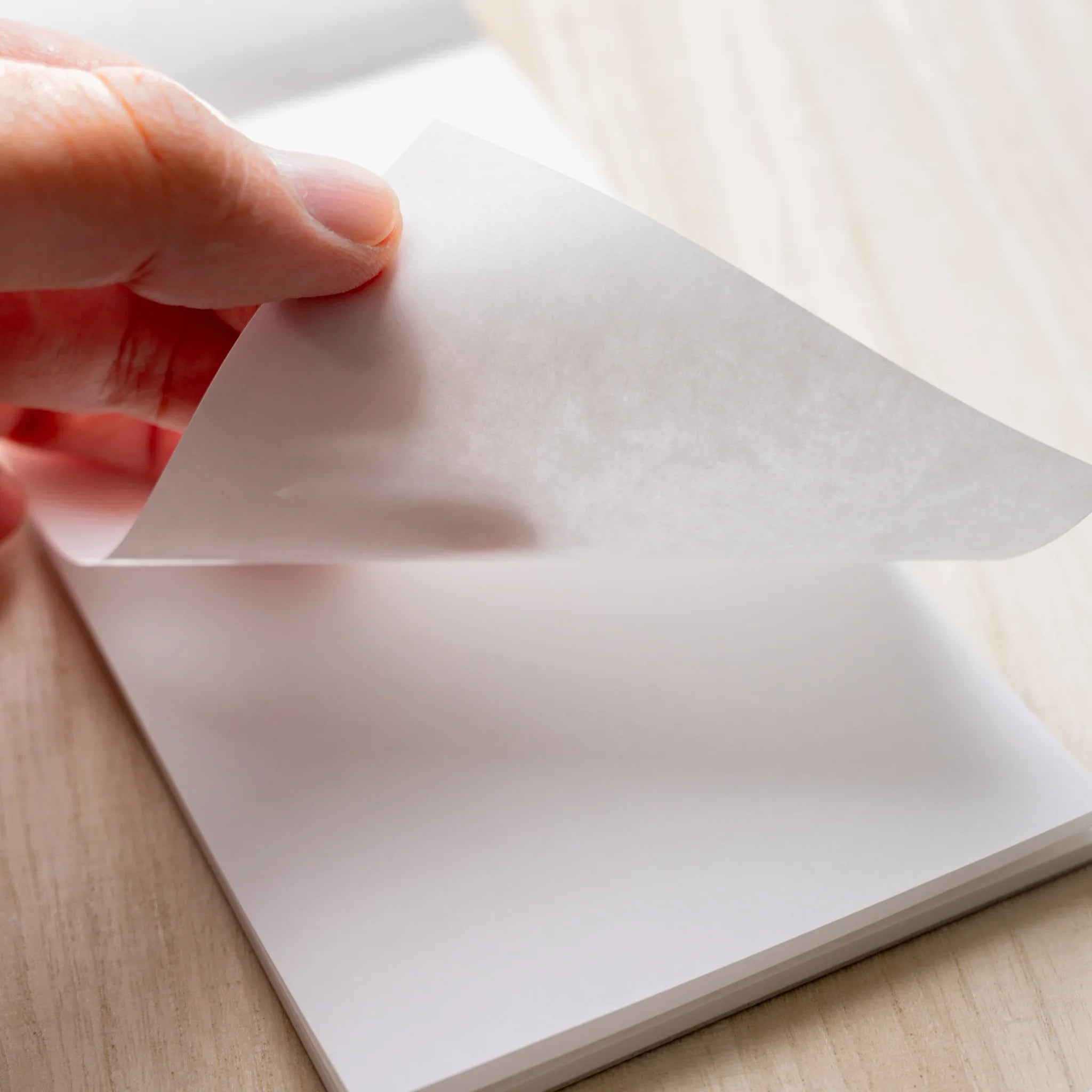Hand peeling a 70gsm Sheep Clouds Bond sheet from Yamamoto Paper Bullet Paper No.3 notepad.