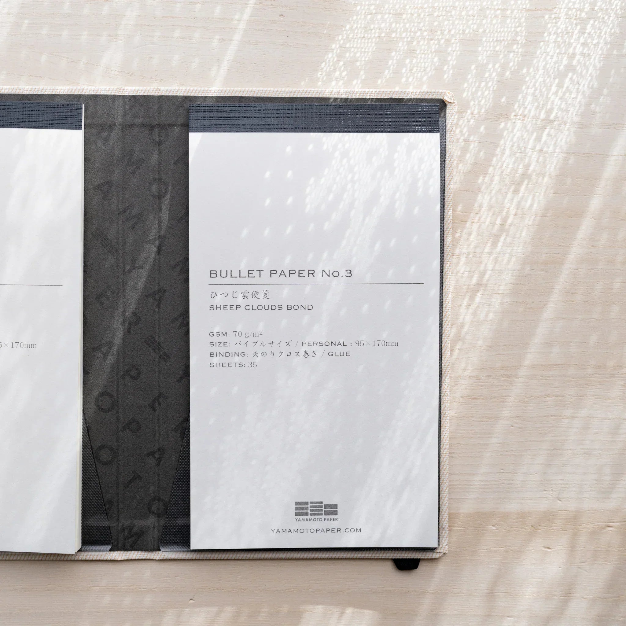 Yamamoto Paper Sheep Clouds Bond Bullet Paper No.3 notepad inserted in a Yamamoto Paper notebook cover.