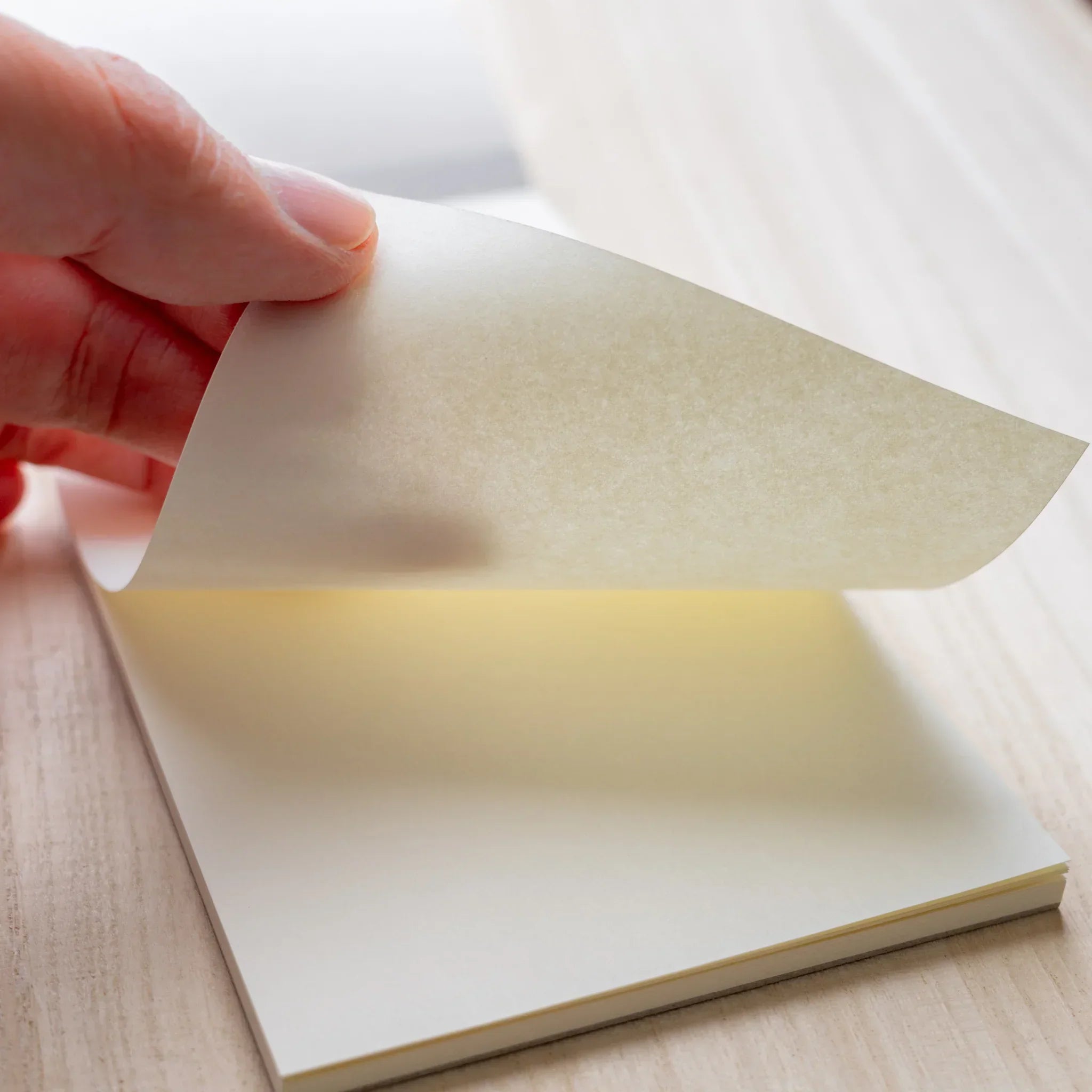 Hand peeling a 65gsm cream Soliste sheet from Yamamoto Paper Bullet Paper No.4 notepad.