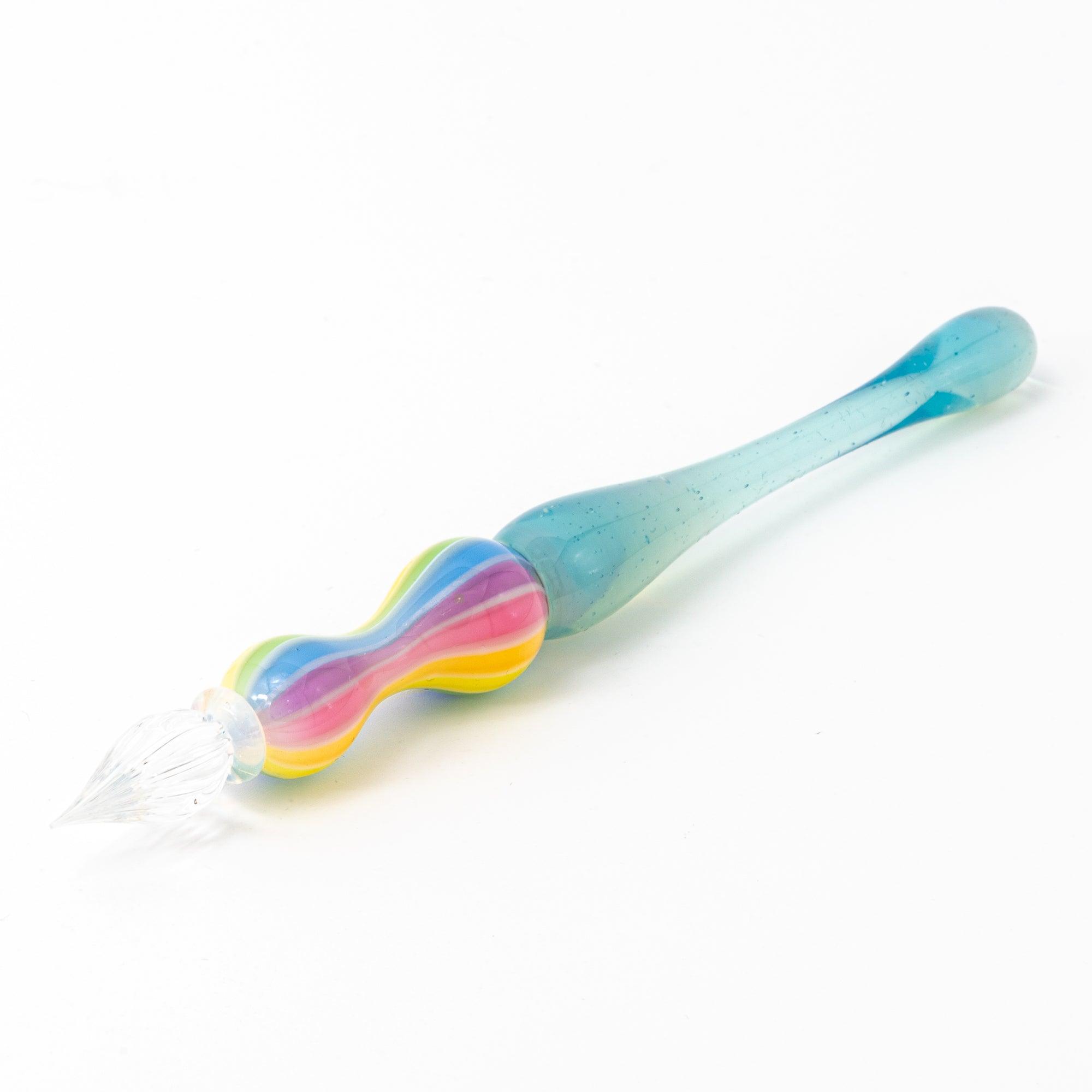 Rainbow balloon glass pen with a blue handle, photographed on a white background. Perfect for Japanese stationery and glass pen enthusiasts.