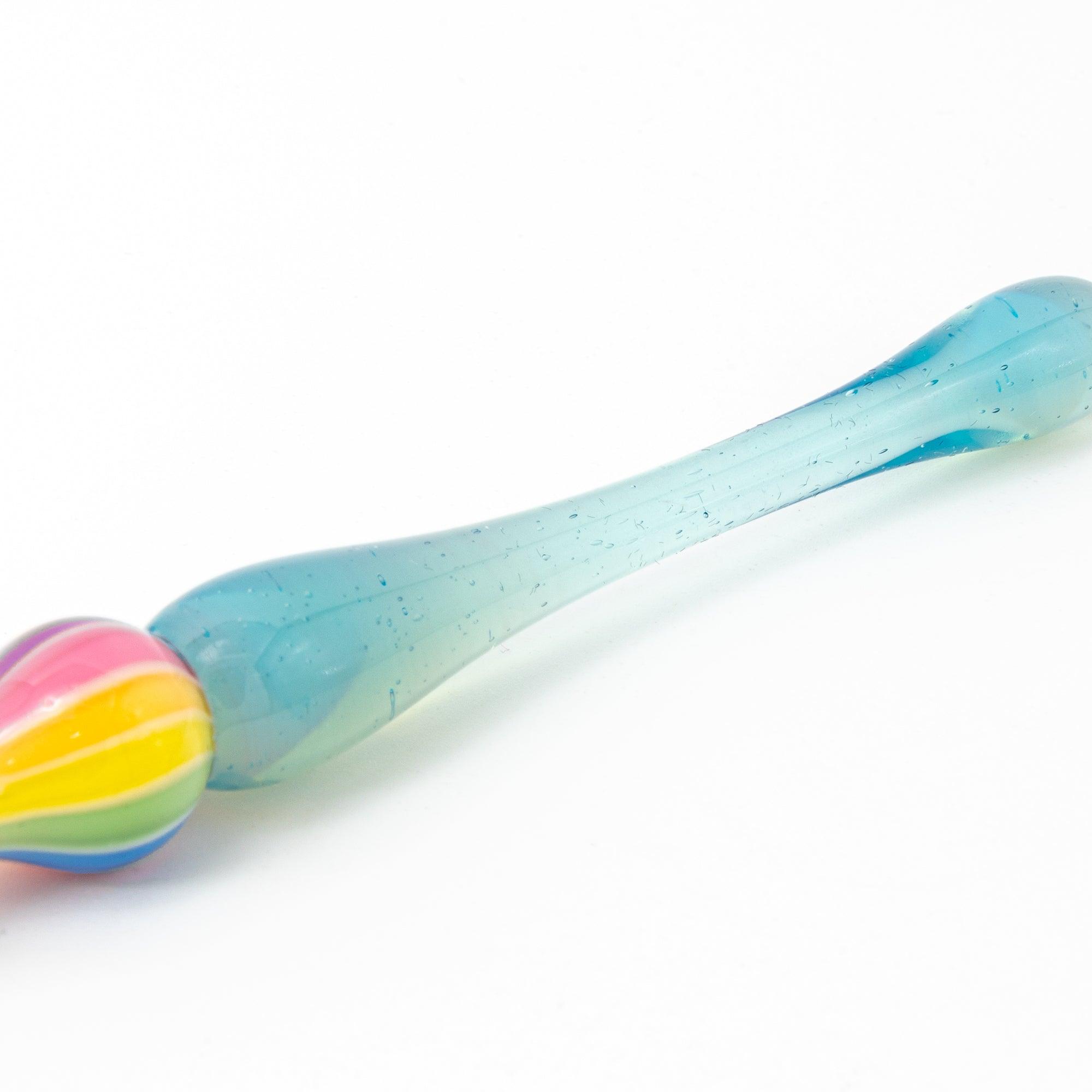 Rainbow balloon glass pen with a blue handle, photographed on a white background. Perfect for Japanese stationery and glass pen enthusiasts.